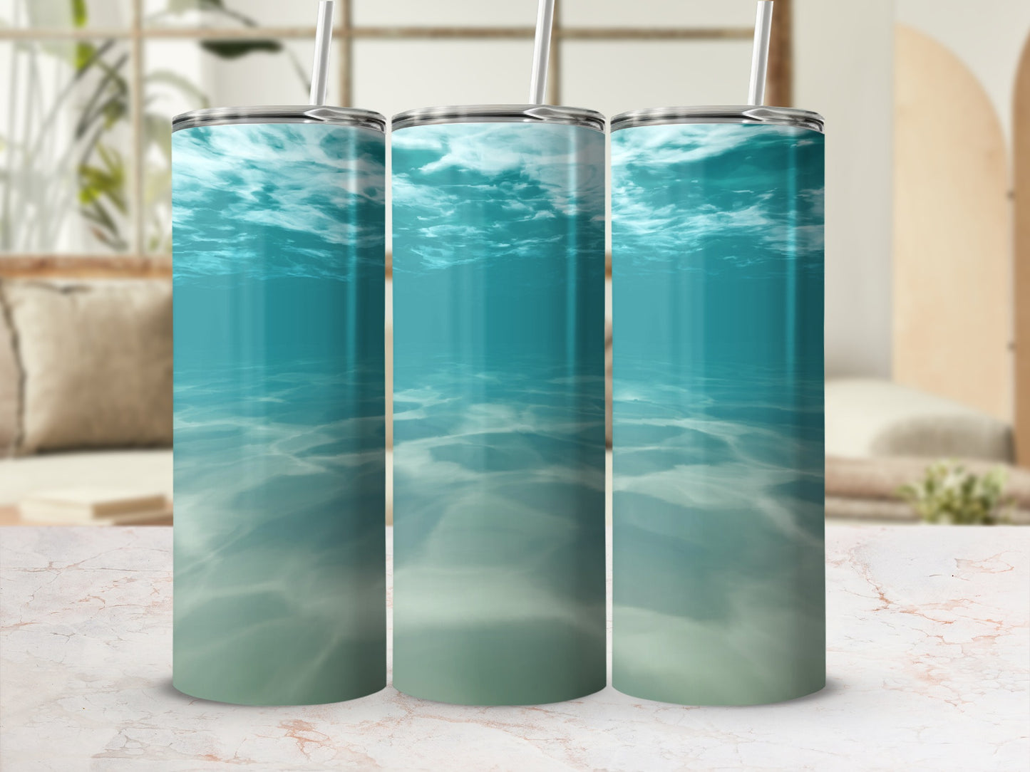 Three tumblers featuring an underwater ocean scene with light filtering through the water.