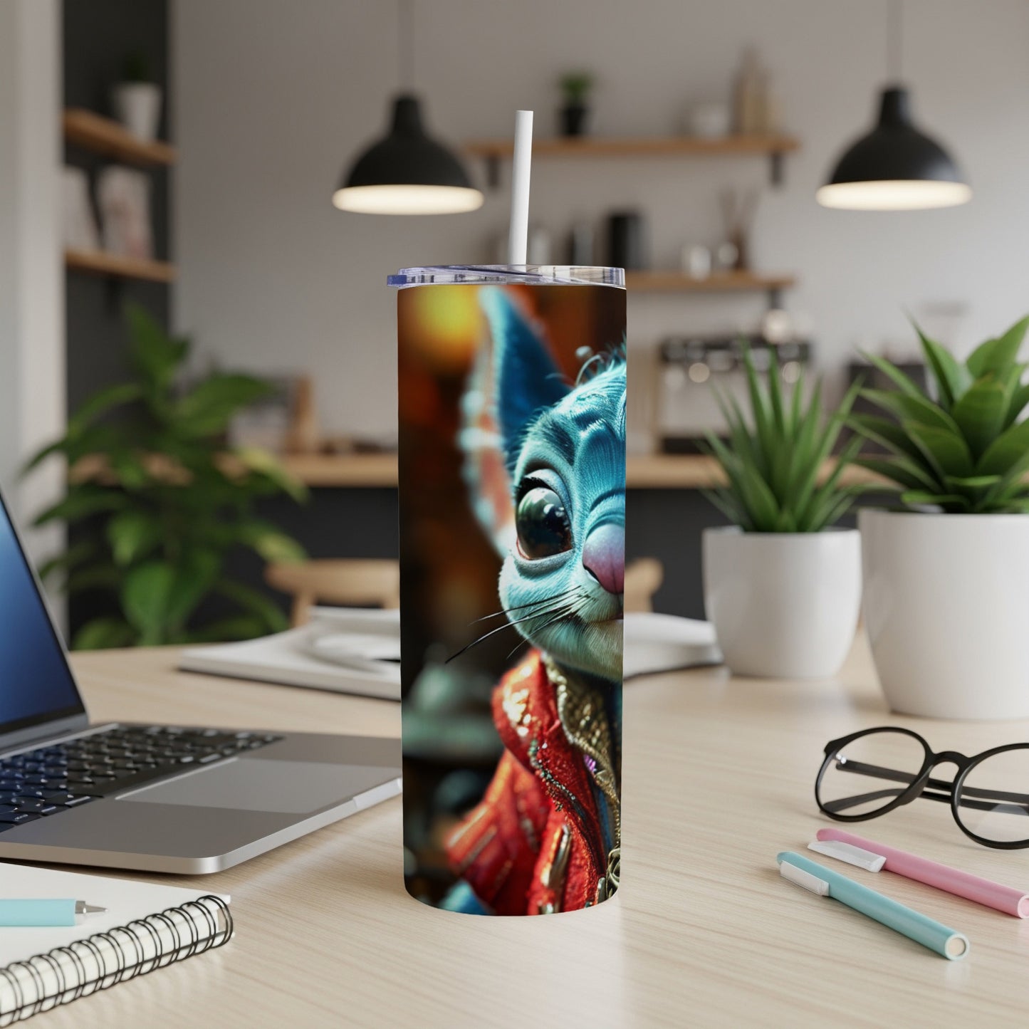 Blue cartoon creature with large eyes on a tumbler with a straw.