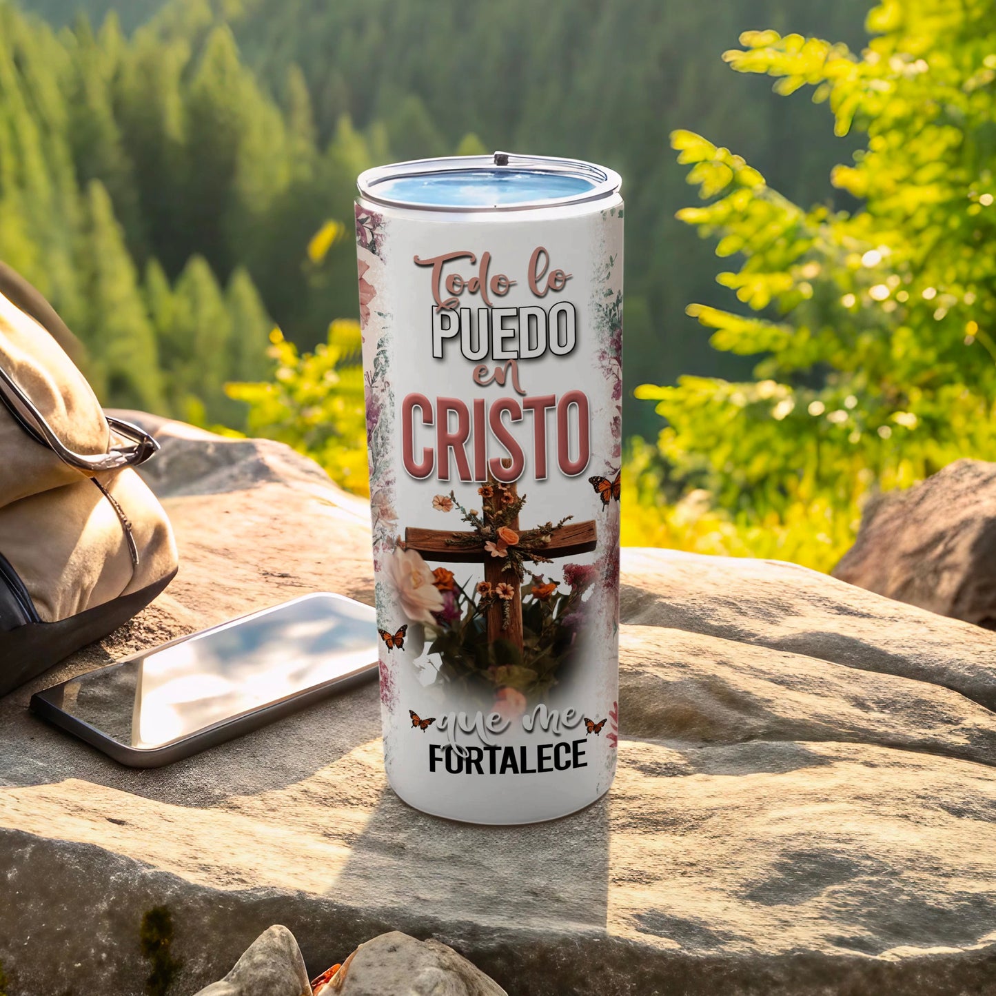Stainless steel tumbler with "Todo lo puedo en Cristo" text and cross design.