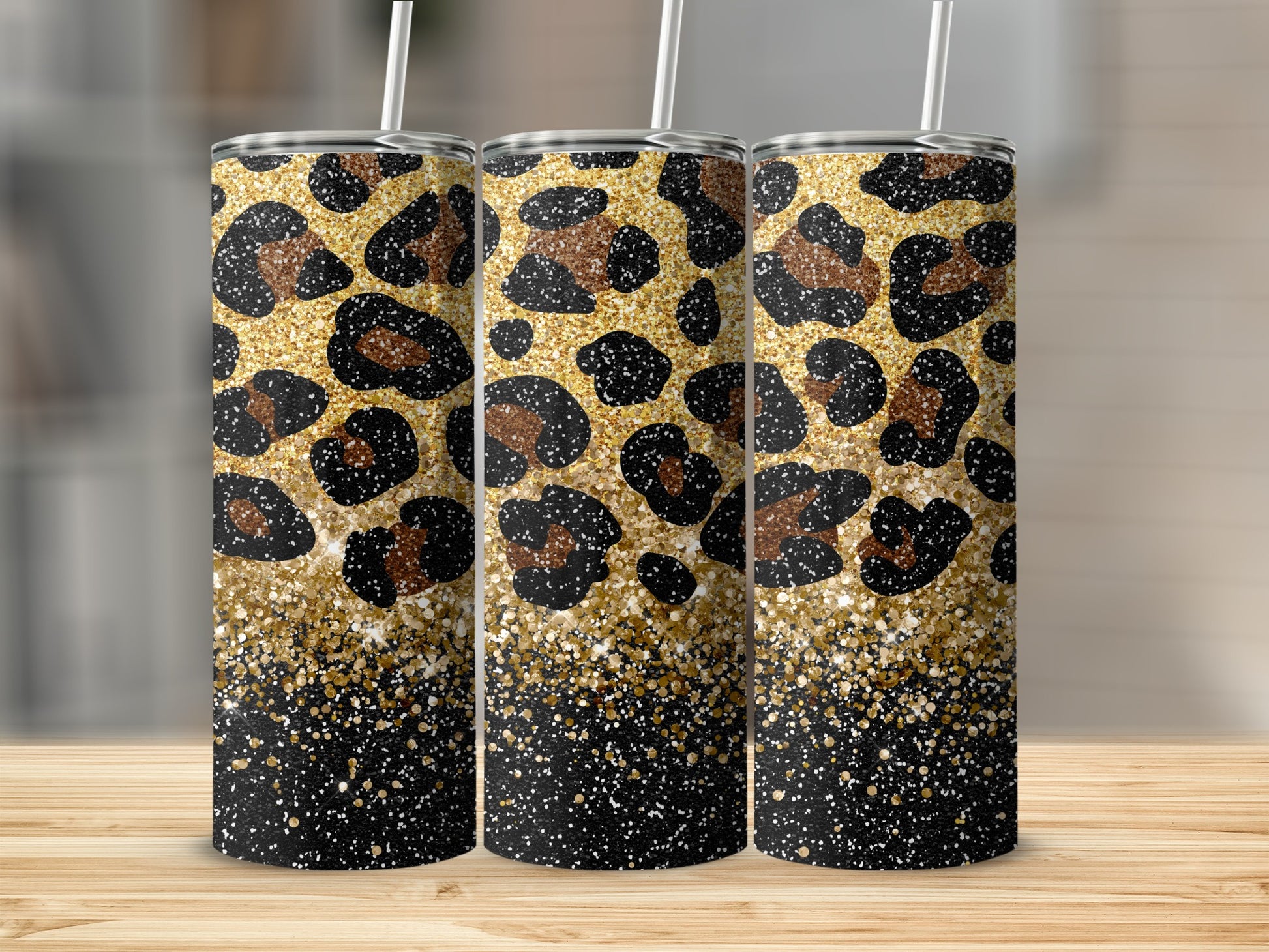 Three tumblers with a leopard print and gold glitter design.