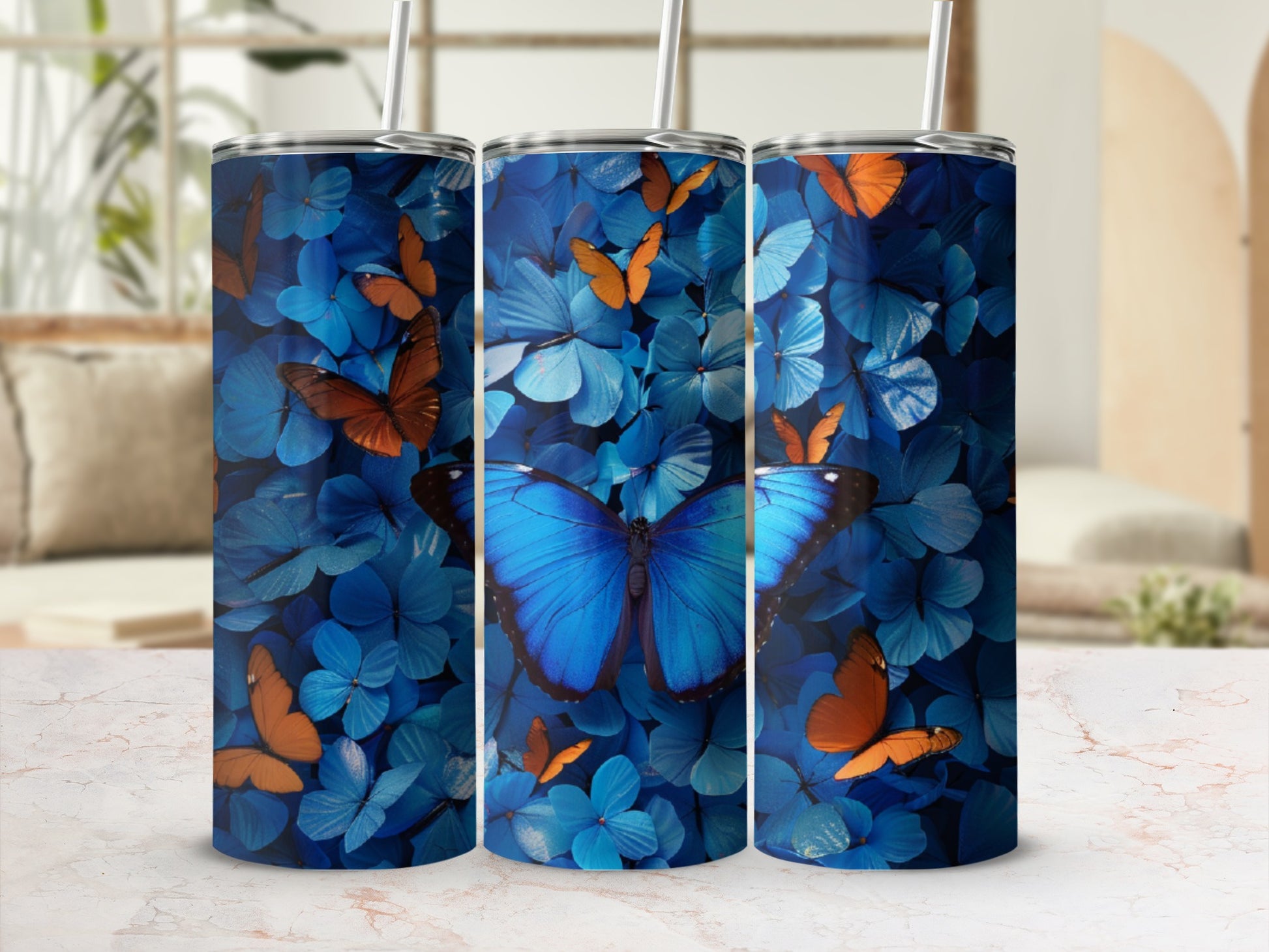 Blue and orange butterflies on a blue floral background, displayed on a tumbler.