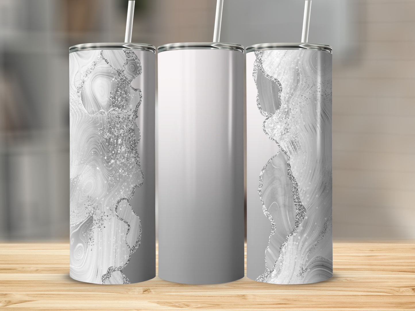 Three tumblers with a white marble and silver glitter design.