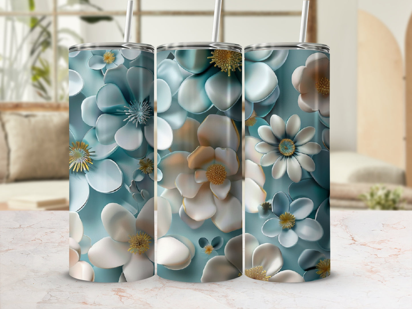 Three tumblers with a muted floral pattern of white, blue, and gold flowers.