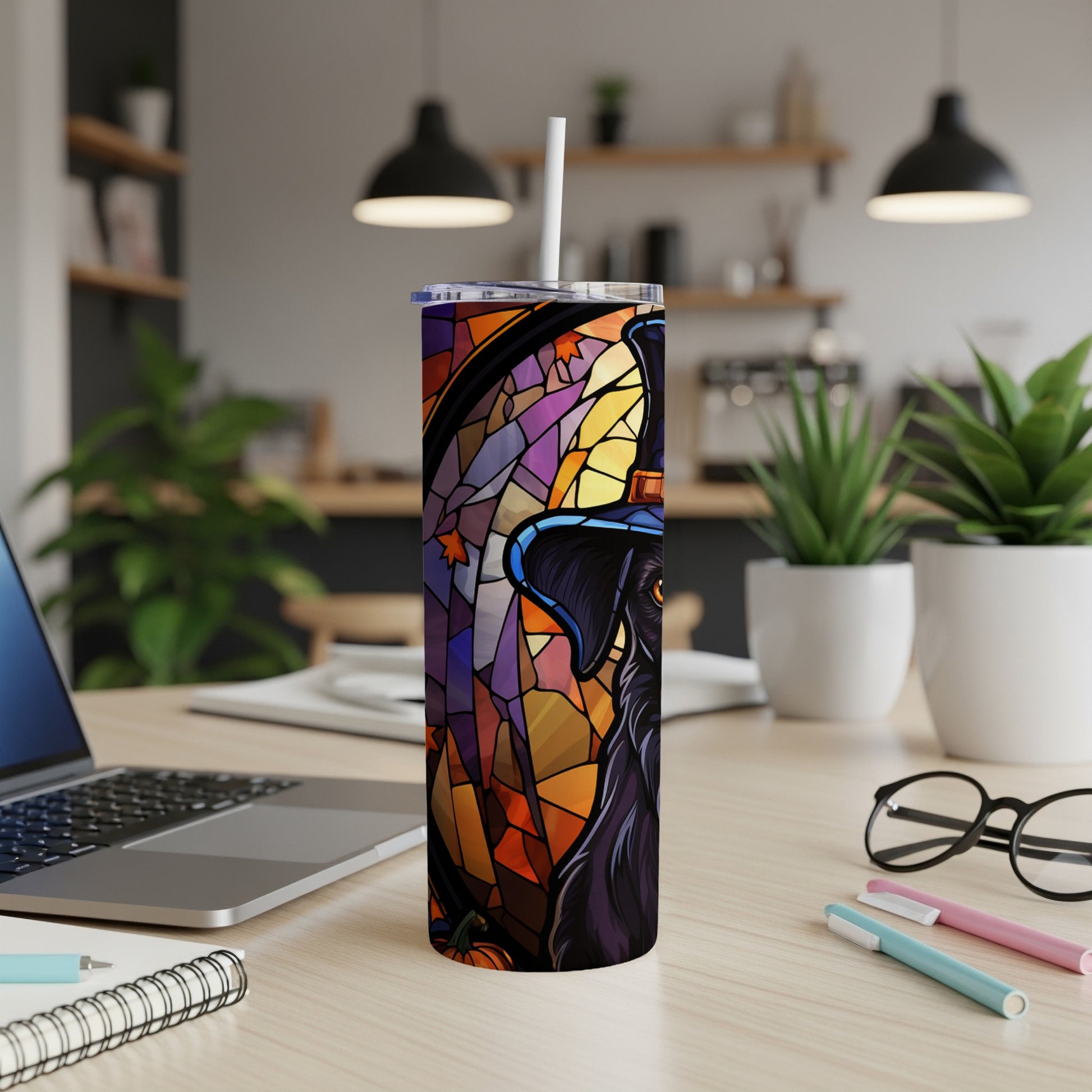 Black dog wearing a witch hat in a stained-glass style on a tumbler.