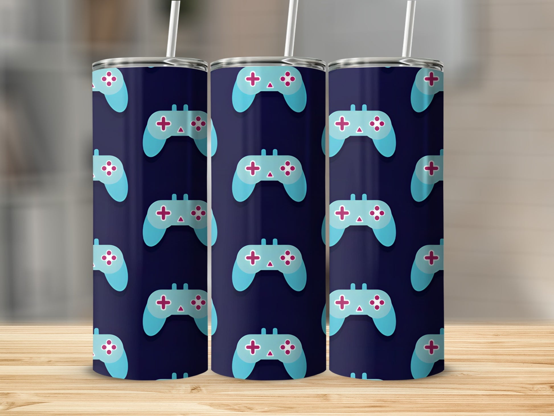 Dark blue tumbler with a repeating pattern of light blue video game controllers.