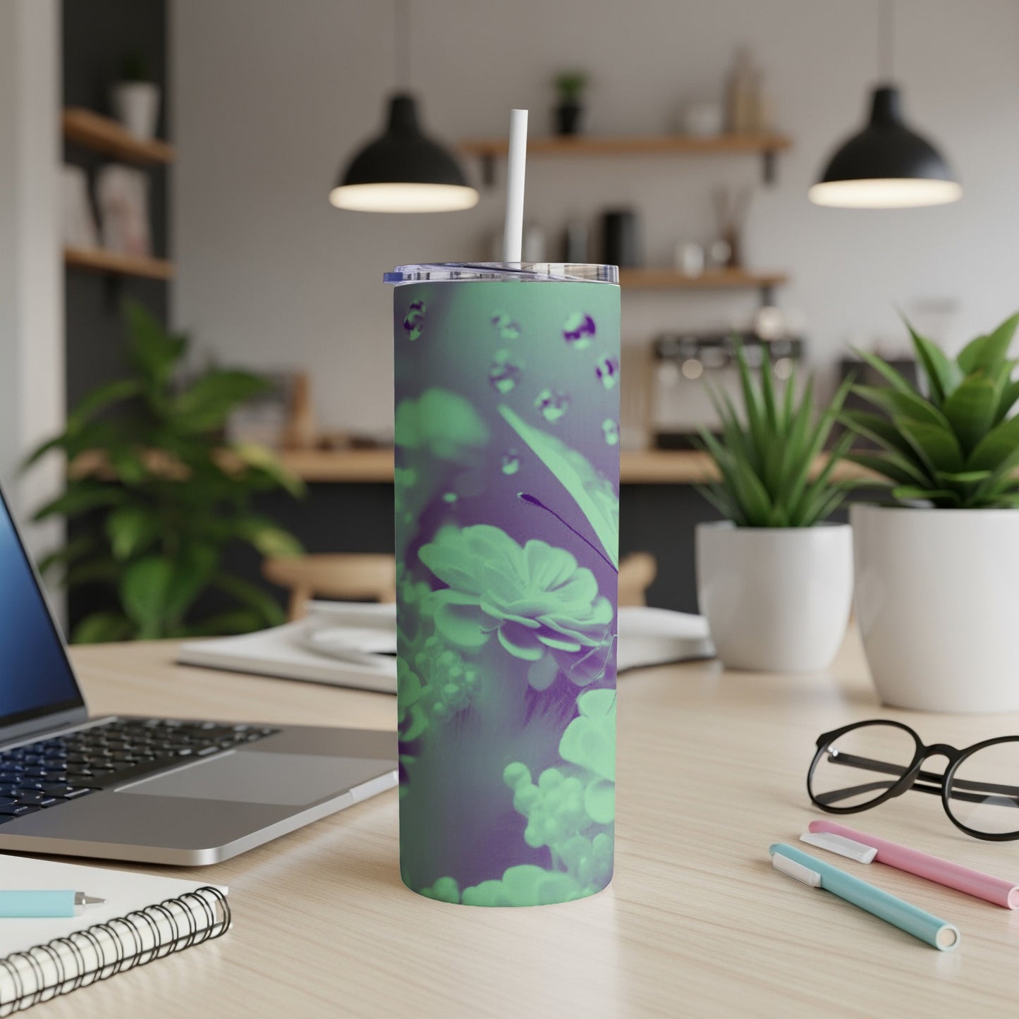 Purple and green tumbler with butterfly and dewdrop pattern.