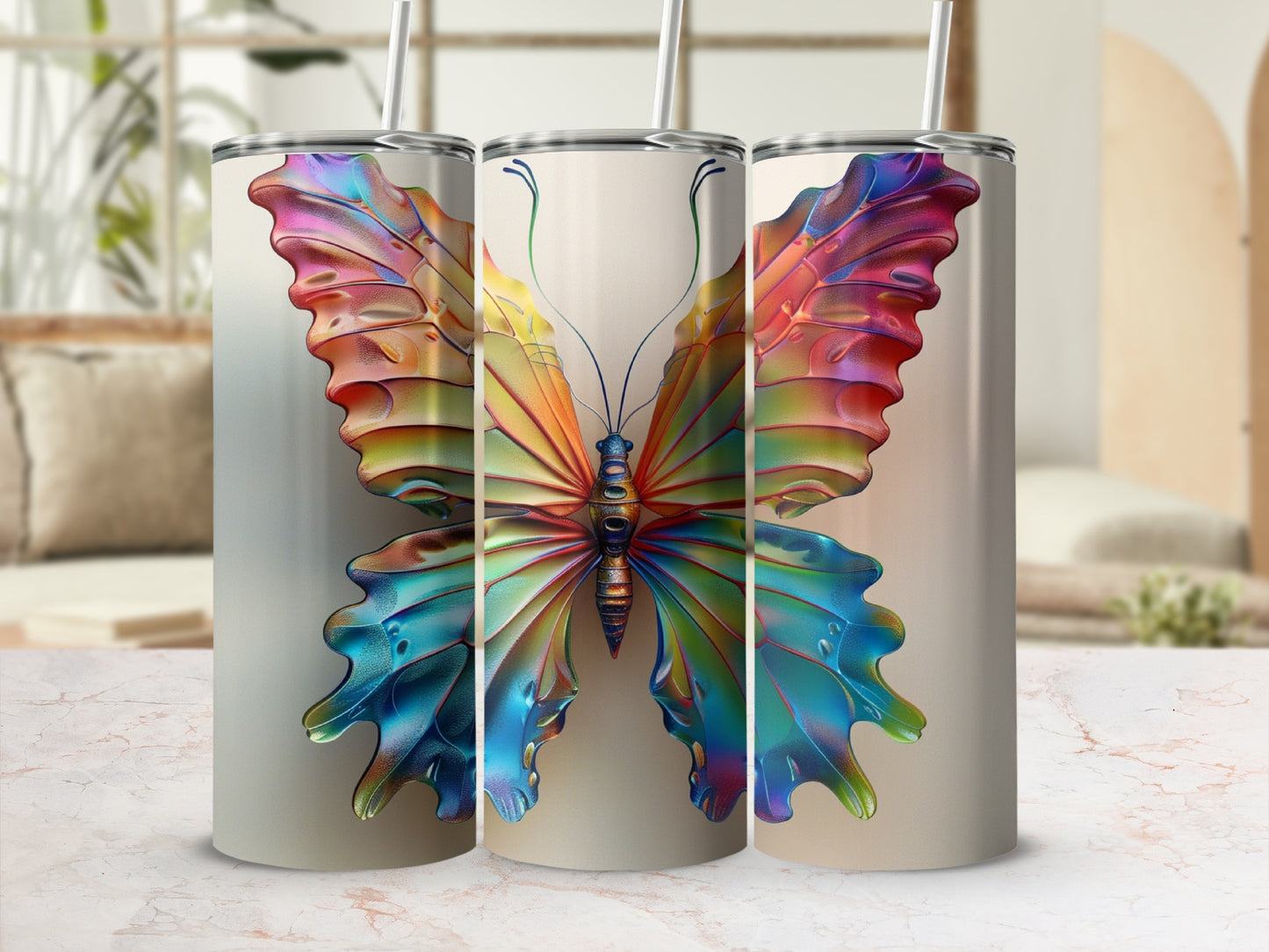 Three tumblers featuring a vibrant, multi-colored butterfly design.