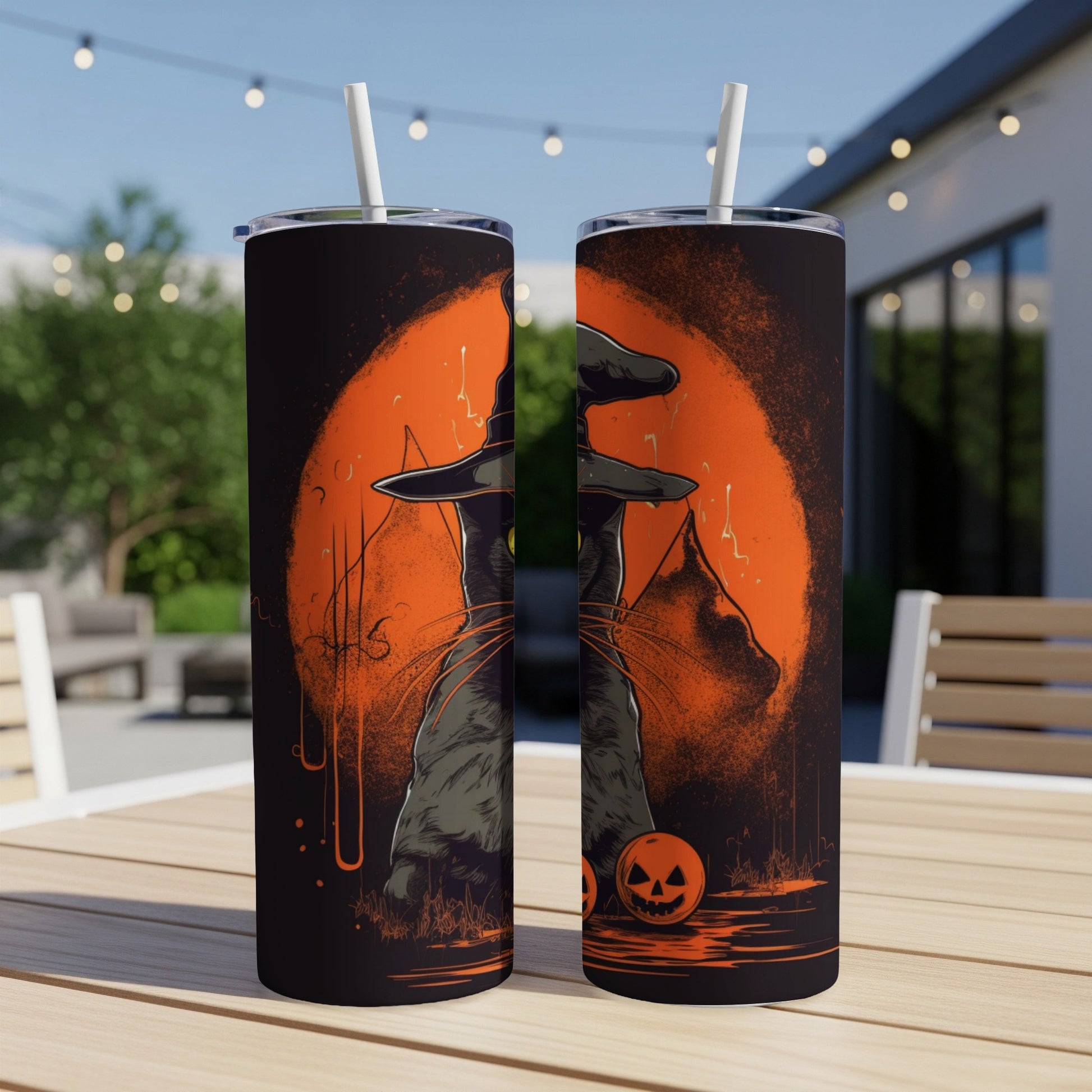Halloween tumbler with black cat wearing witch hat and pumpkins.