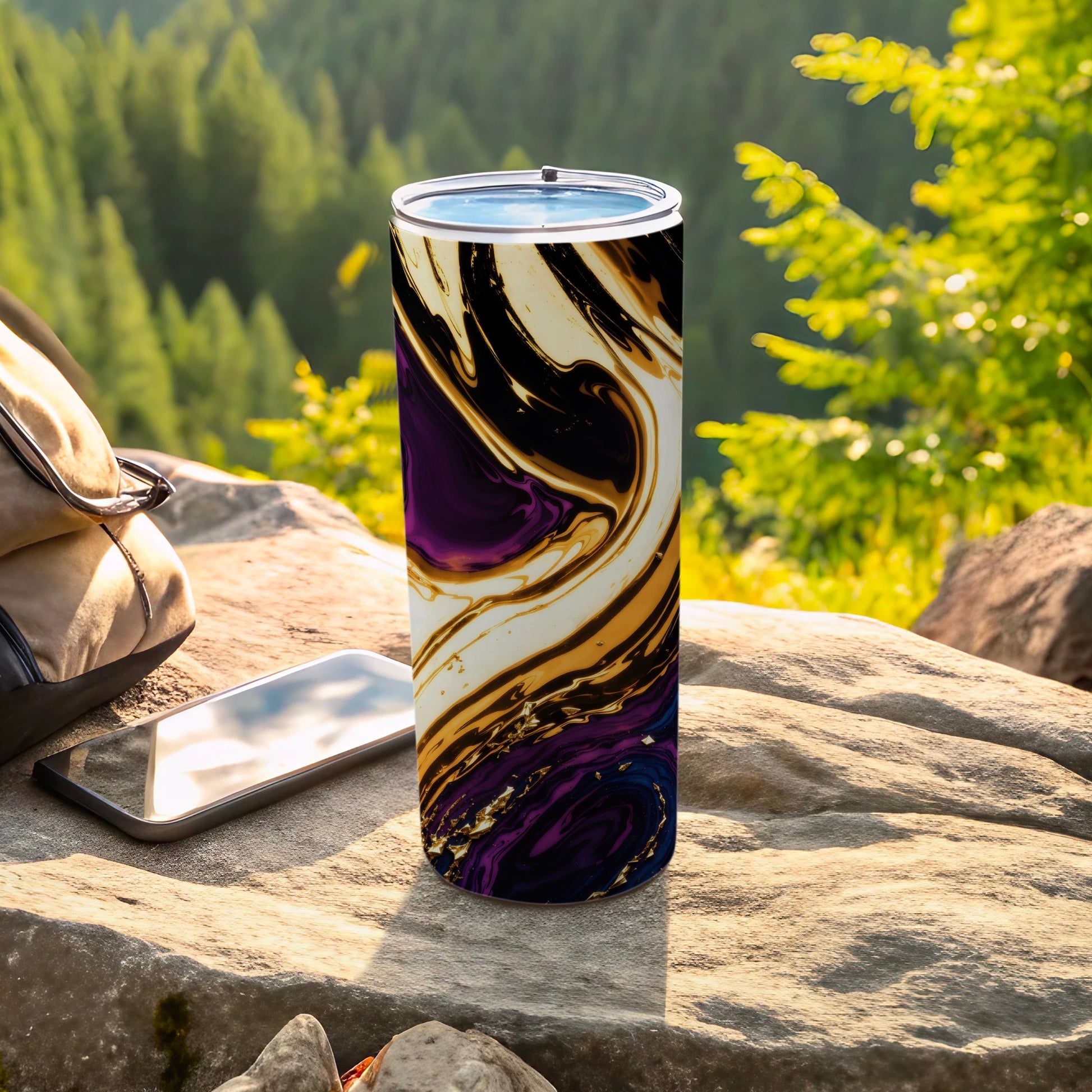Tumbler with swirling black, purple, and gold abstract pattern.