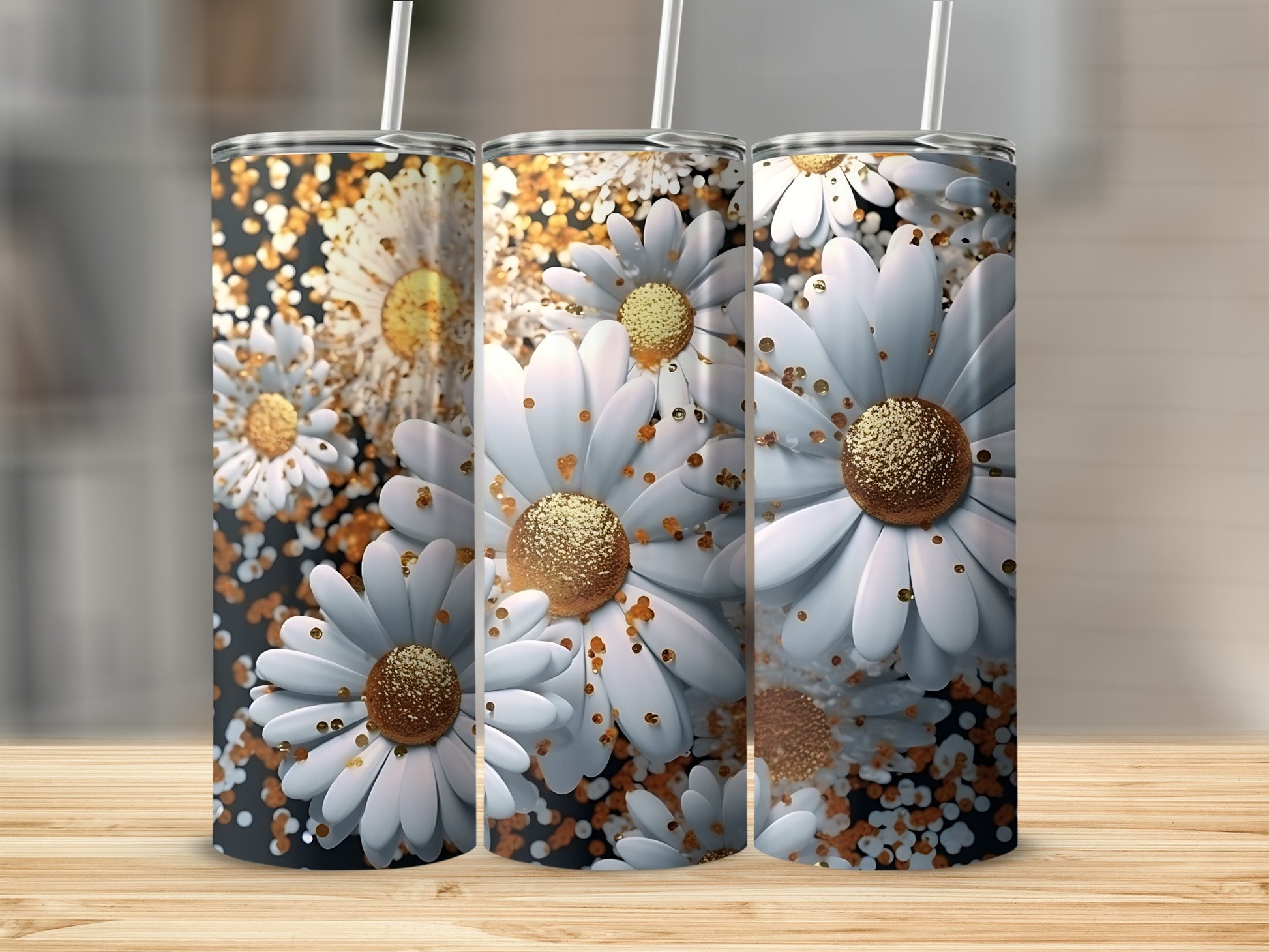Three tumblers with white daisies and gold glitter accents on a wooden surface.