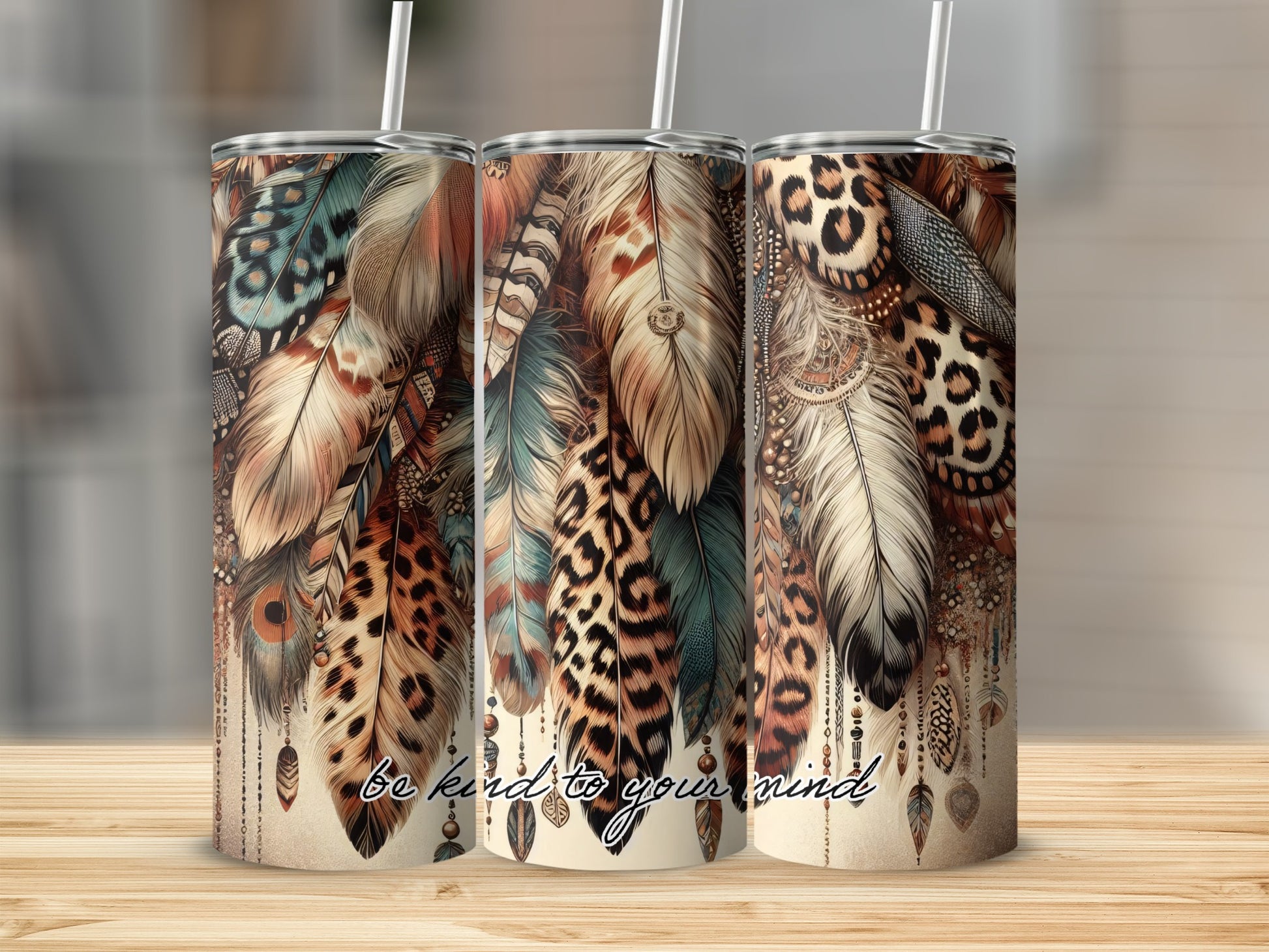 Triptych of tumblers with feather and leopard print designs, "be kind to your mind" text.