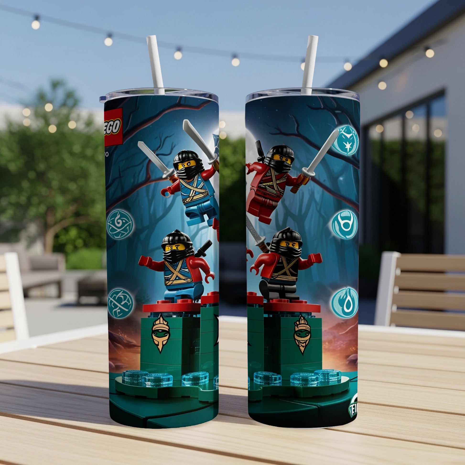 Two Lego Ninjago tumblers with characters on a table outdoors.