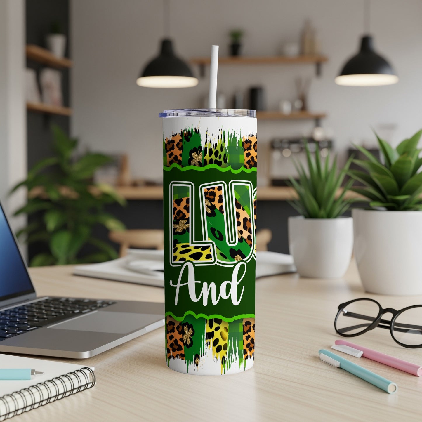Green and gold leopard print tumbler with "LU" and "And" text.