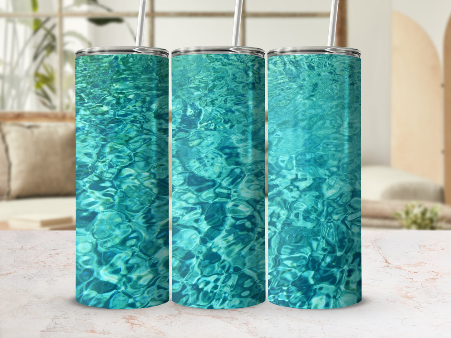Three tumblers with a rippling turquoise water design.