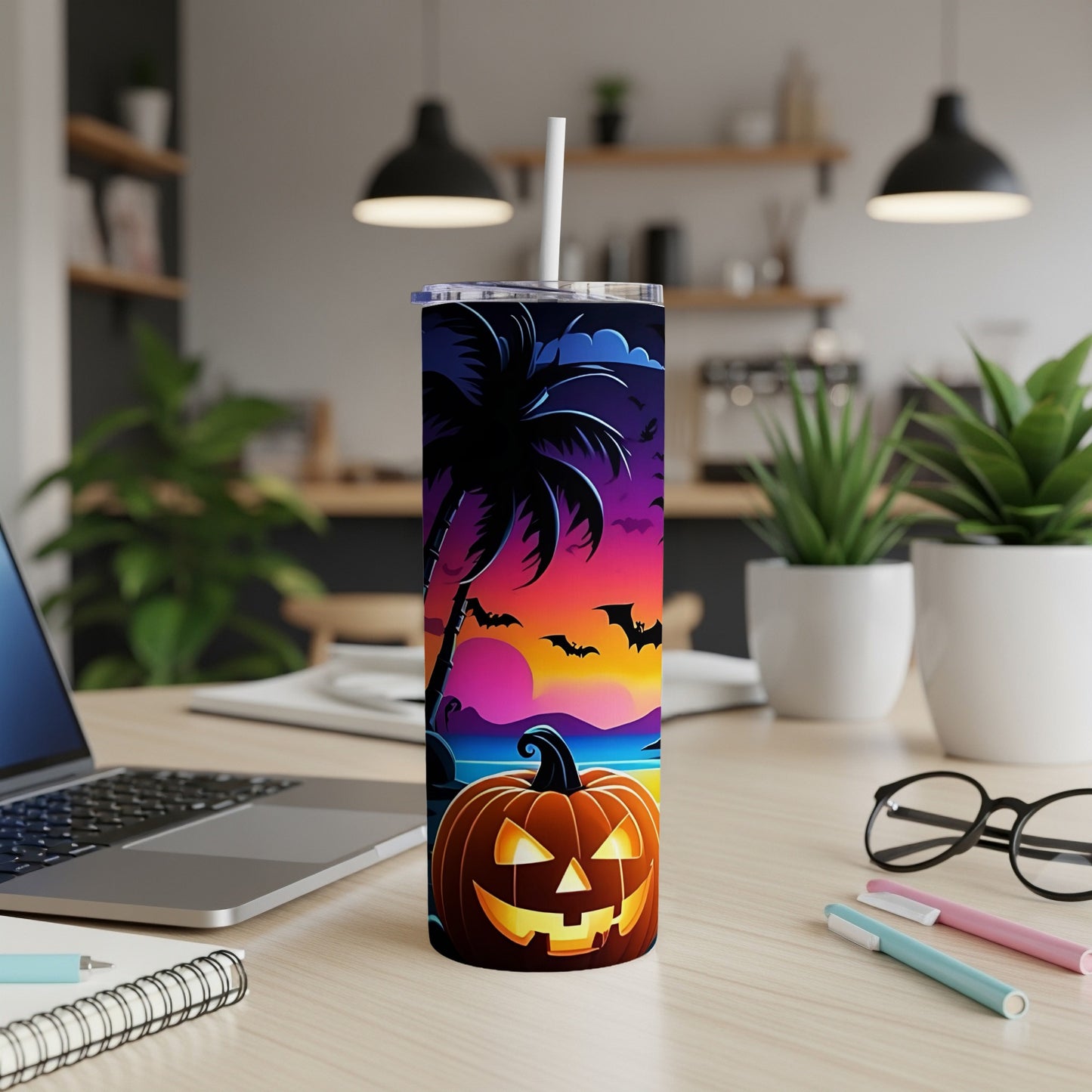 Halloween tumbler with pumpkin and bats on a tropical sunset background.