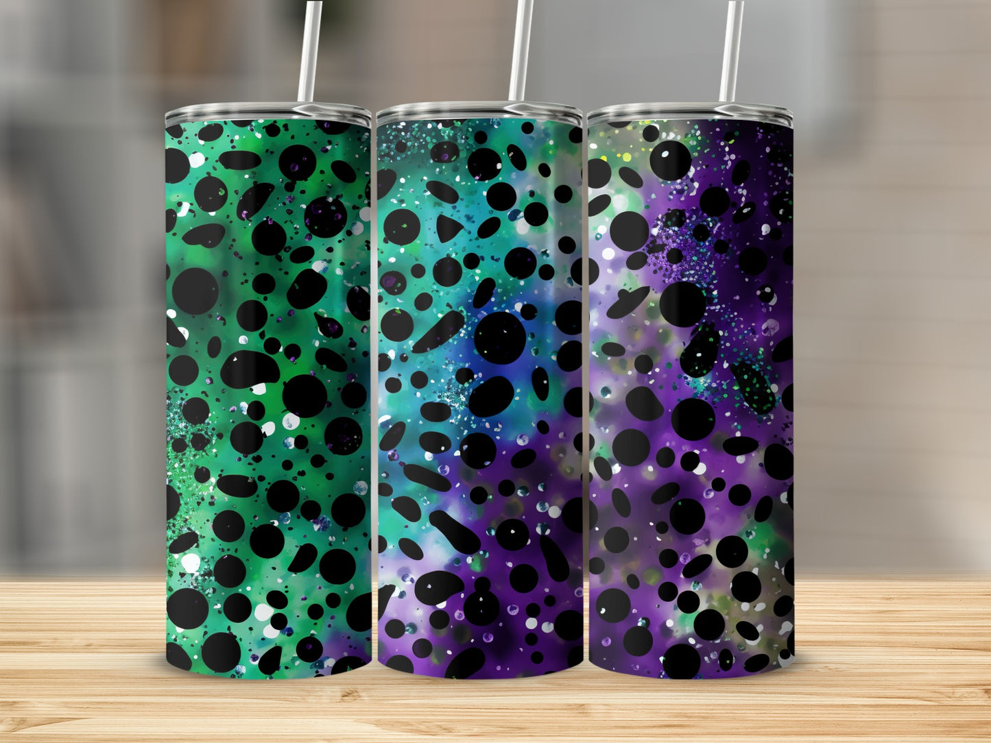 Three tumblers with green, blue, and purple abstract watercolor patterns and black polka dots.