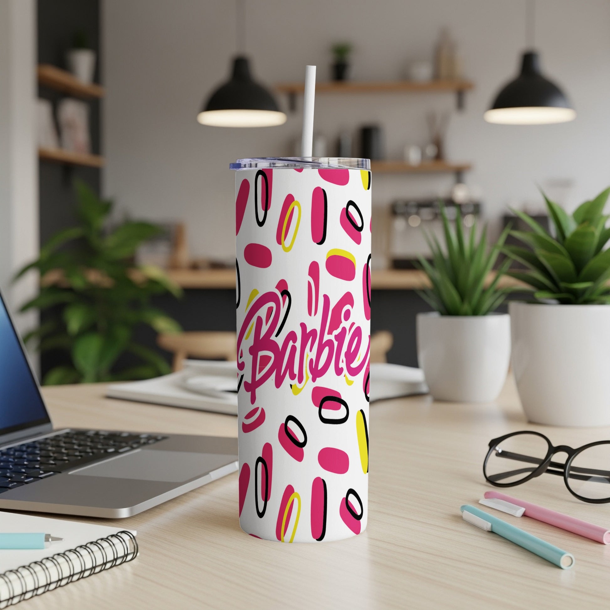 Pink and white Barbie tumbler with colorful circles and lines.