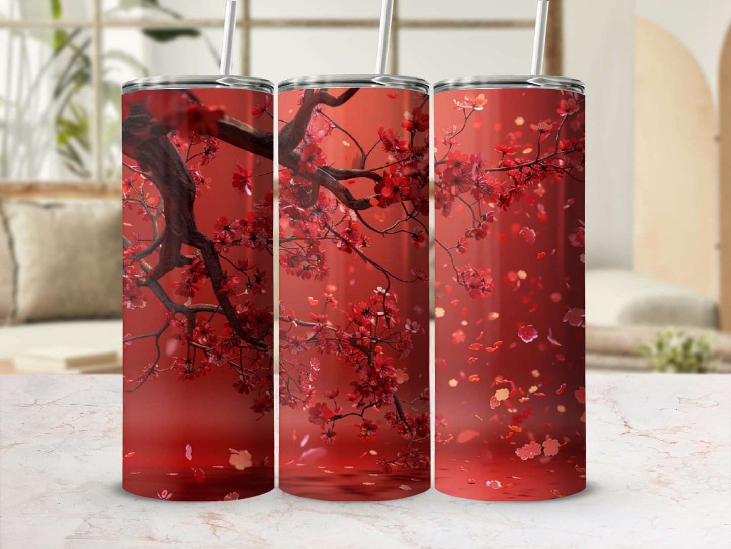 Three red tumblers with cherry blossom branches and falling petals.
