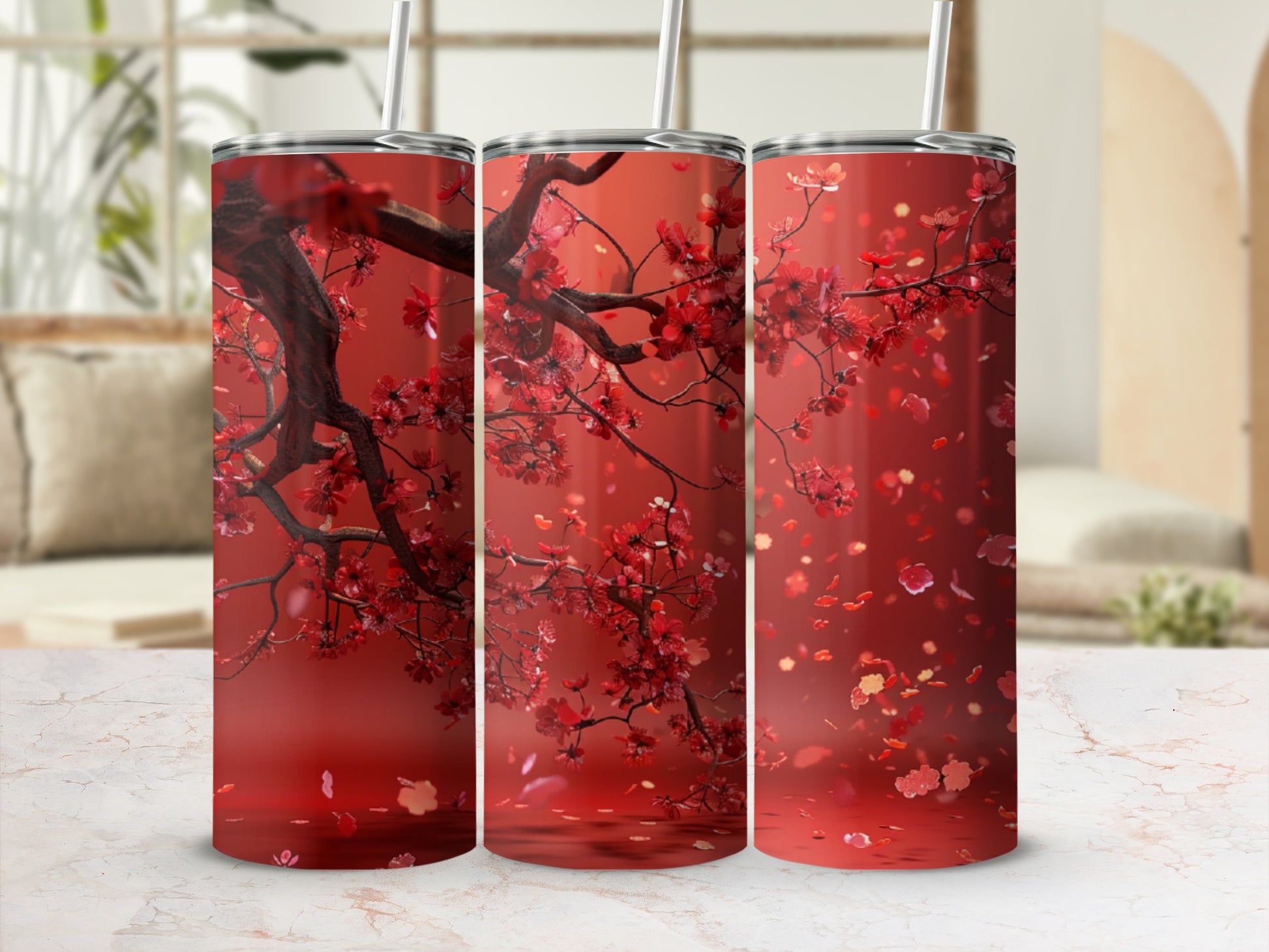 Three red tumblers with cherry blossom branches and falling petals.