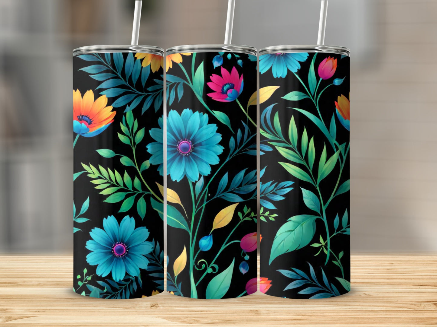 Three tumblers with a vibrant floral pattern on a black background.