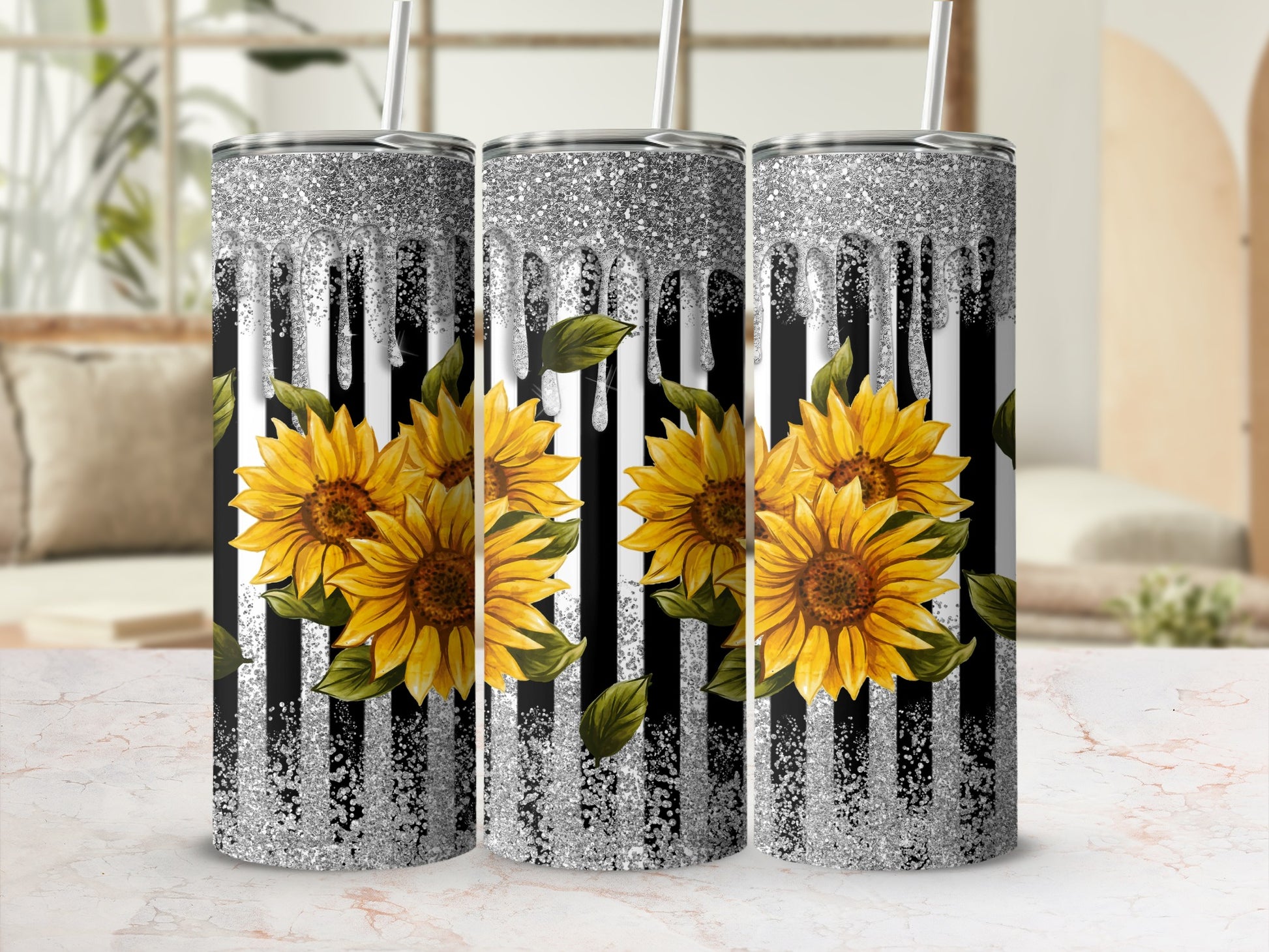Three tumblers with sunflowers and silver glitter drip design.