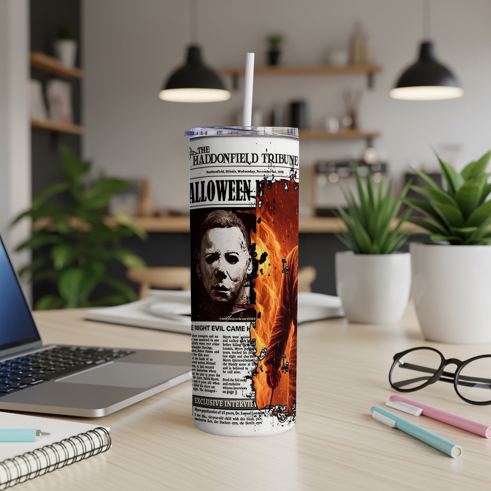 Halloween Tribune newspaper wrap on a tumbler with Michael Myers' face.