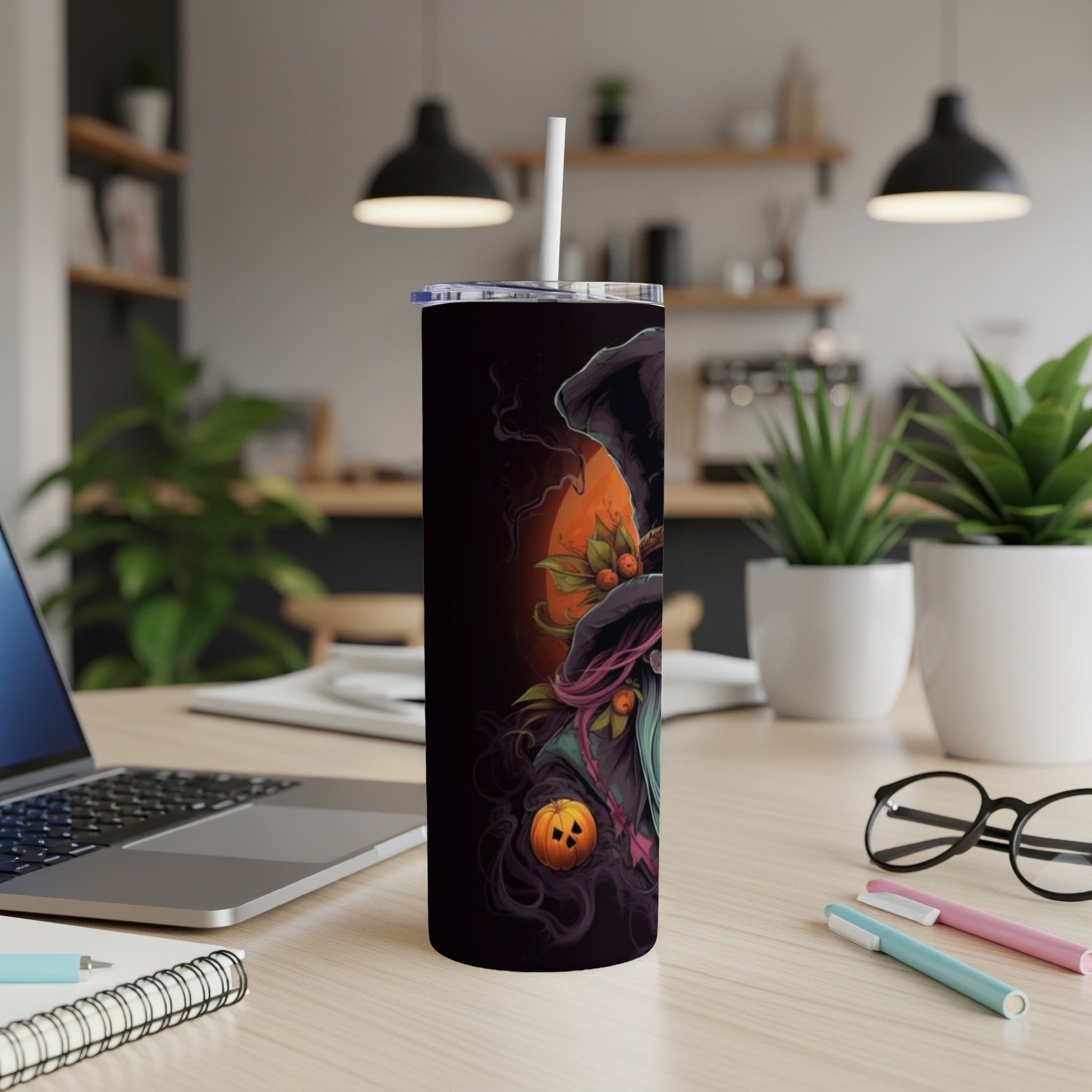Tall tumbler with a Halloween witch and pumpkin design.