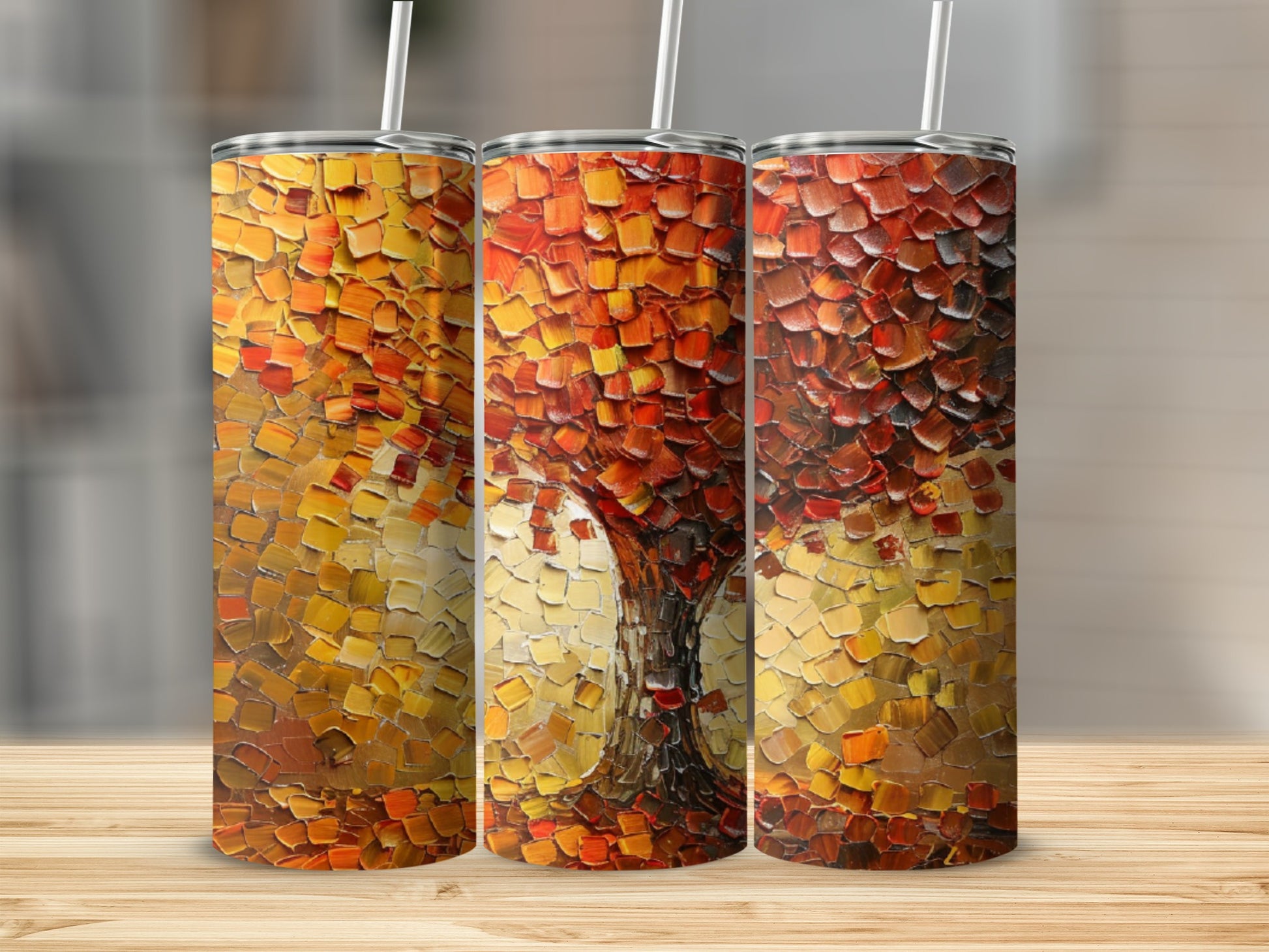 Abstract oil painting of a tree with autumn colors on three tumblers.