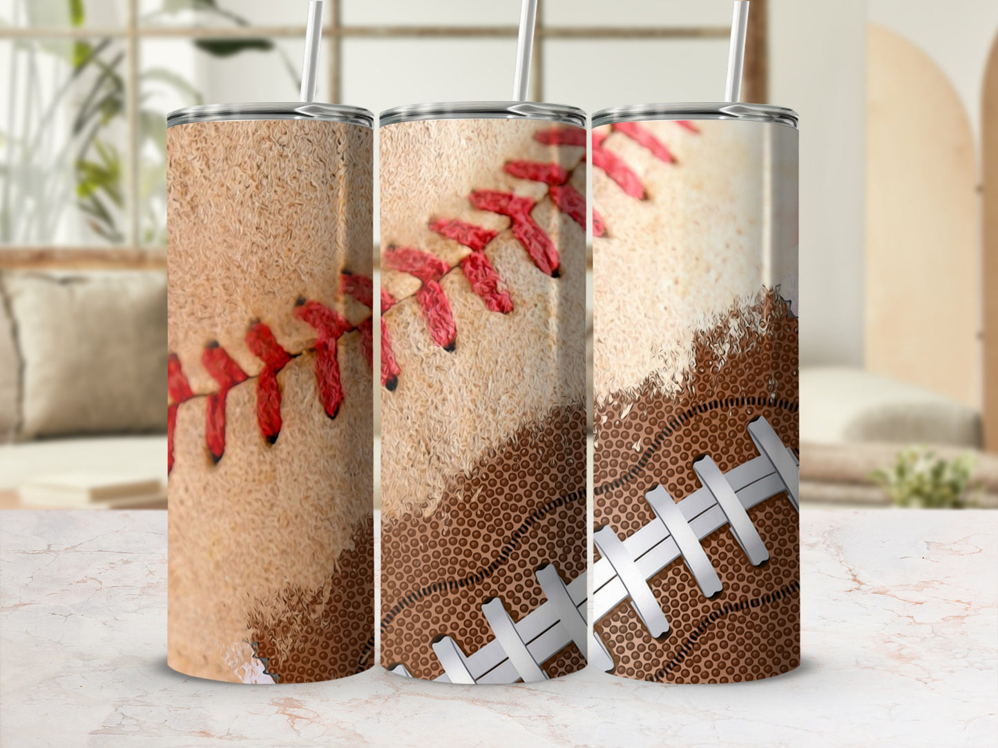 Three tumblers with a baseball texture and red stitching.