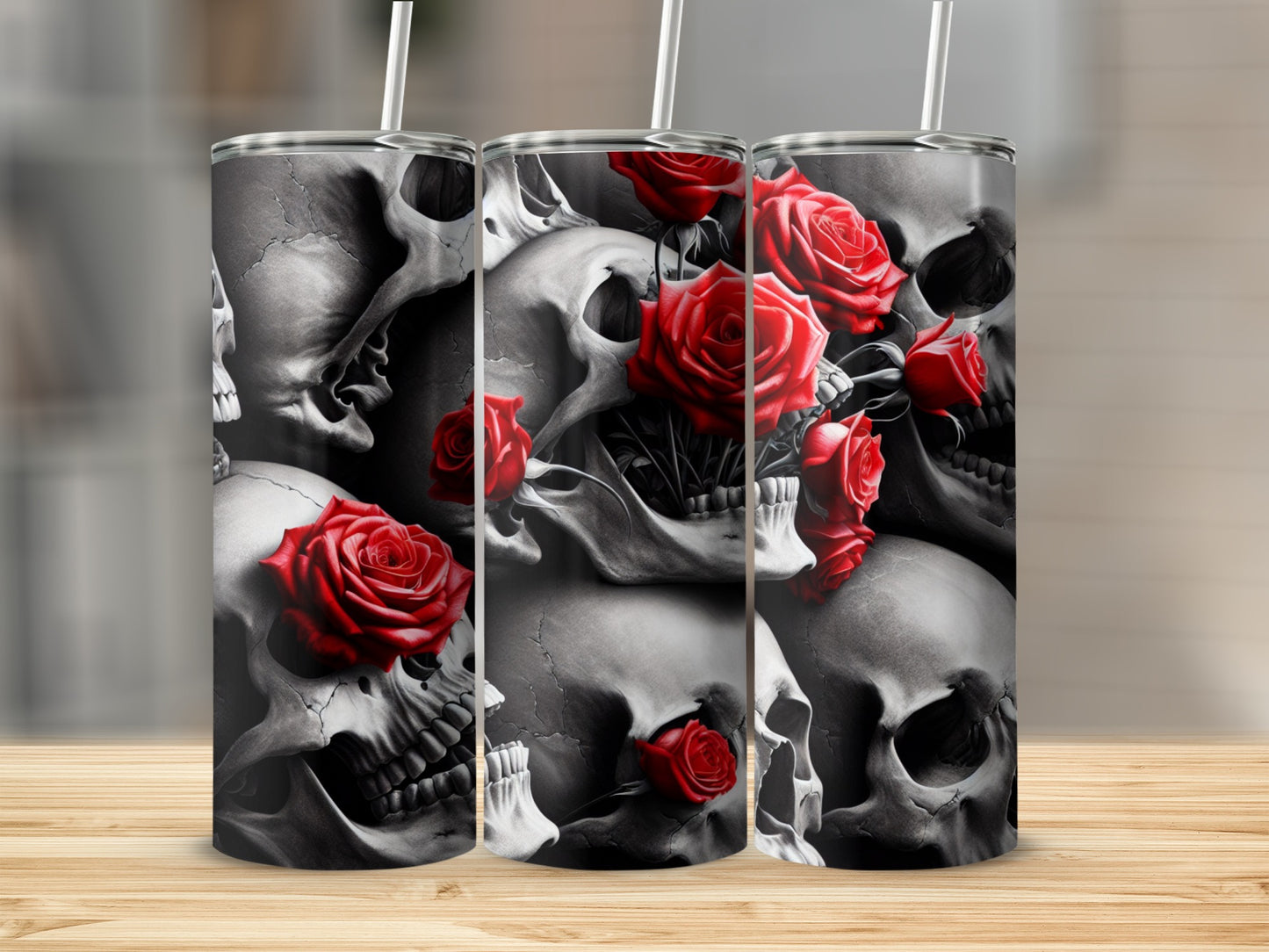 Skulls and red roses design on three tumblers with straws.