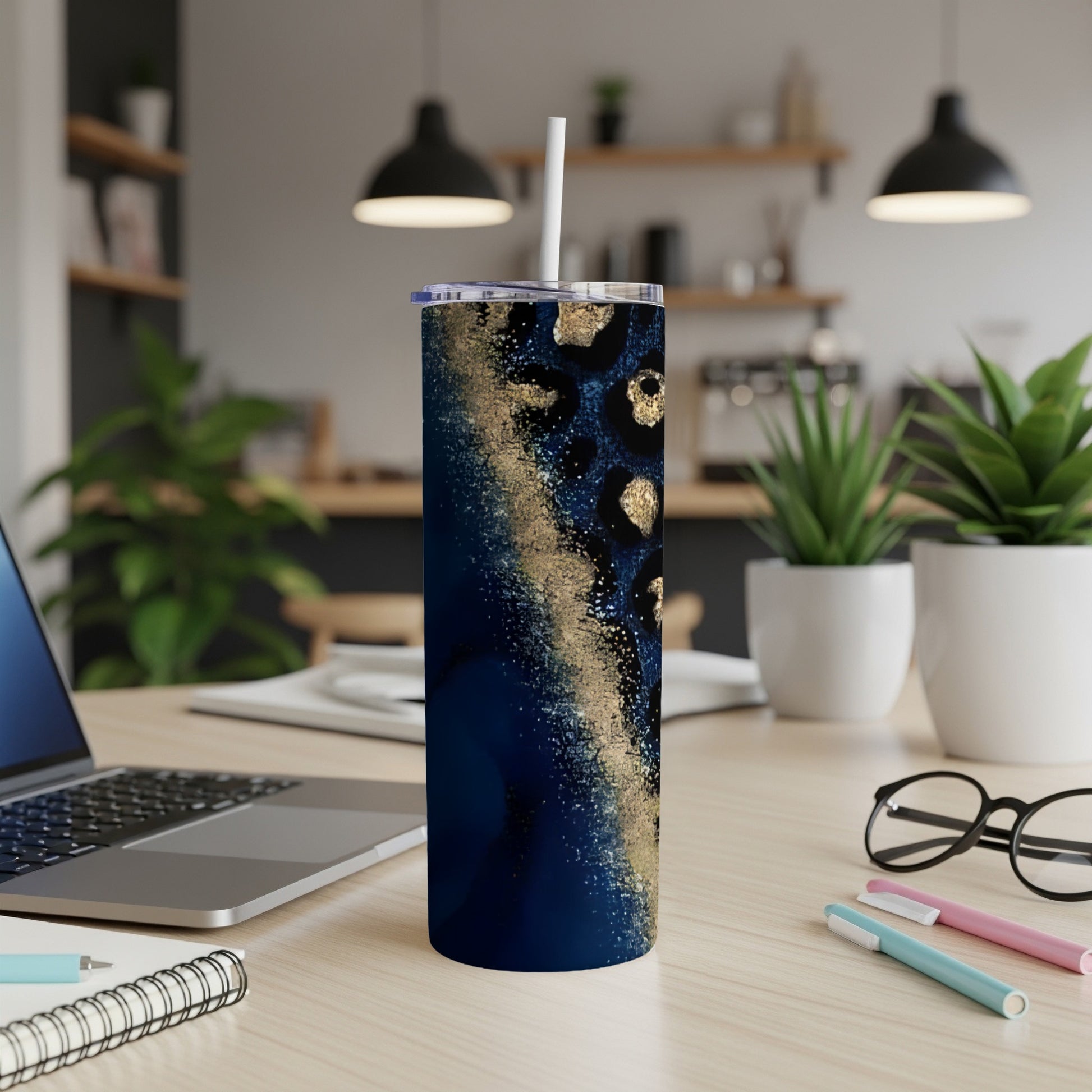 Tumbler with blue and gold abstract marble and leopard print design.