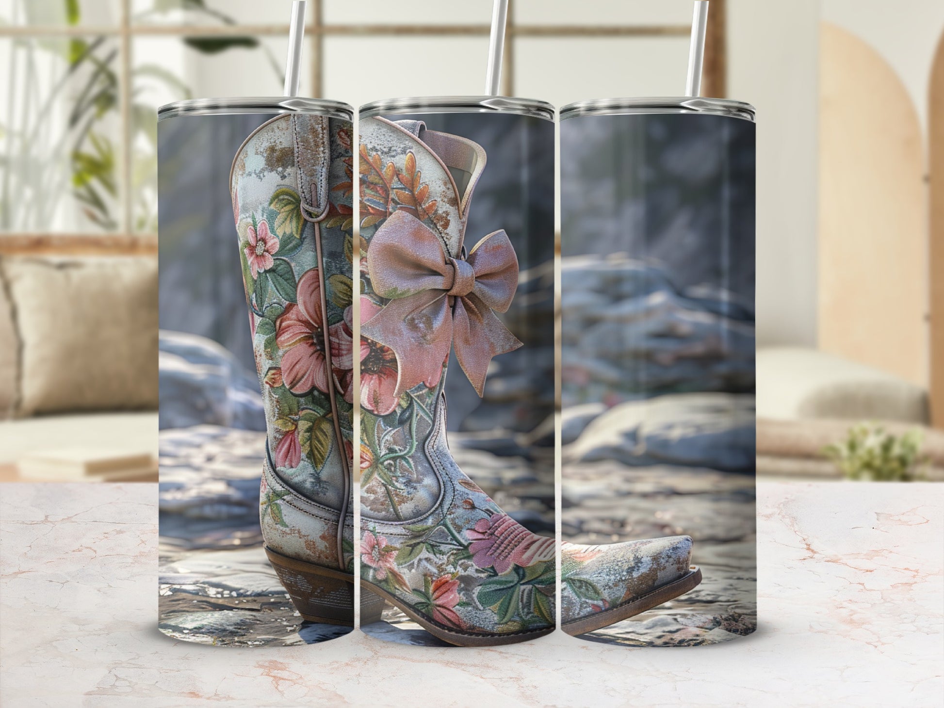 Cowboy boot with floral pattern and pink bow on a stone surface.