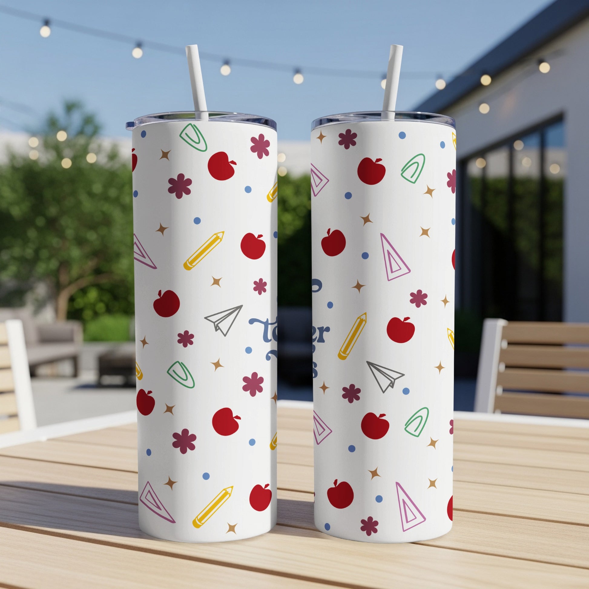 Two white tumblers with colorful school icons and "Teacher" text.