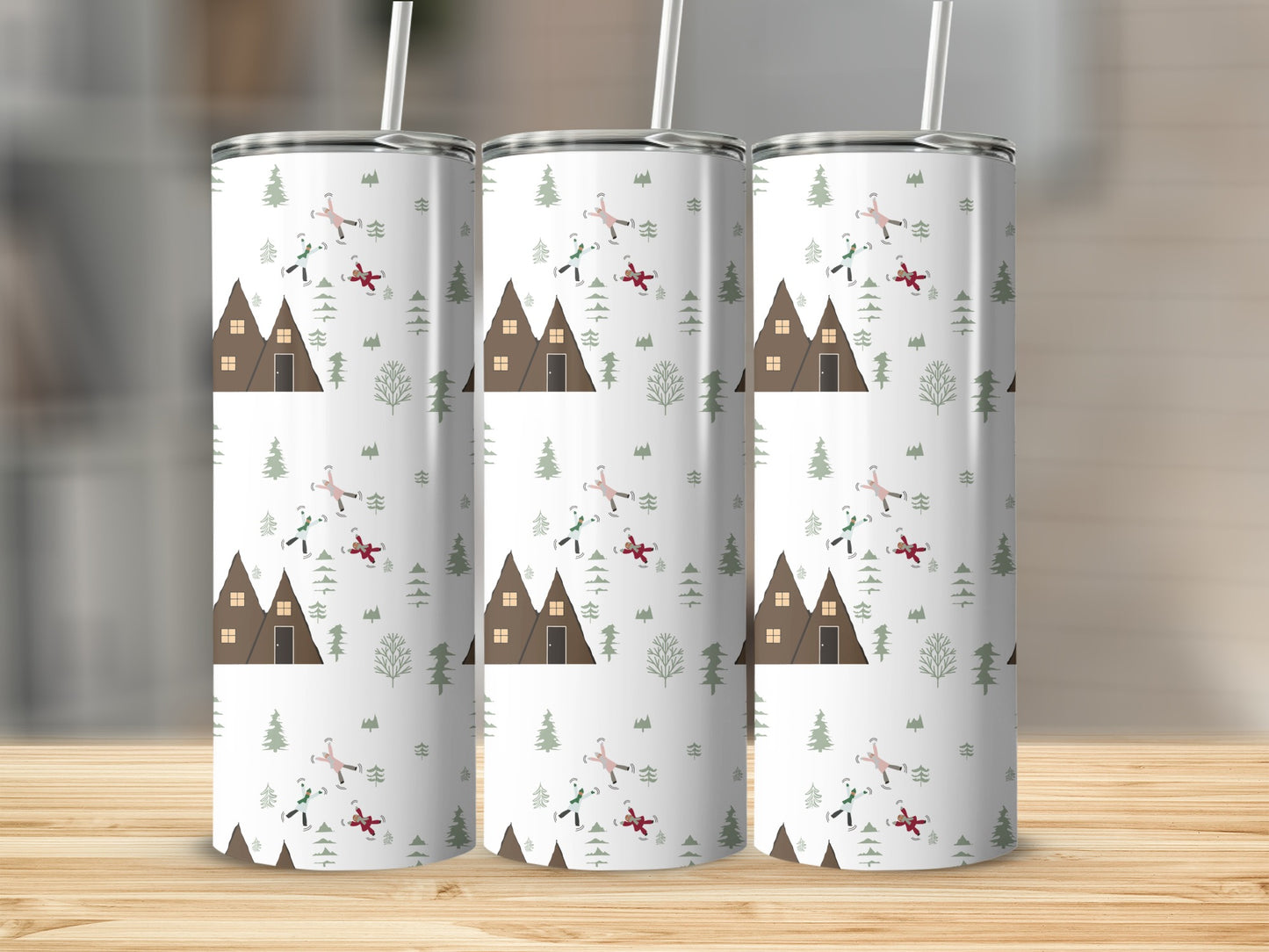 Three tumblers with a winter cabin and skiers pattern.