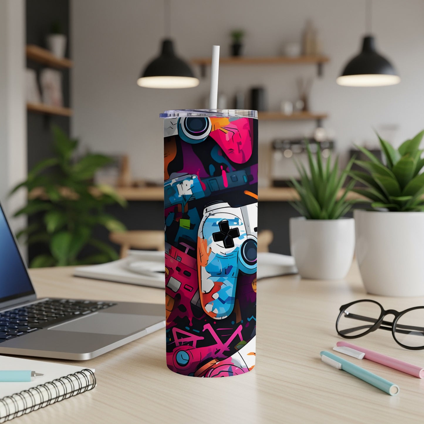 Tall, colorful tumbler with gaming controller and button graphics.