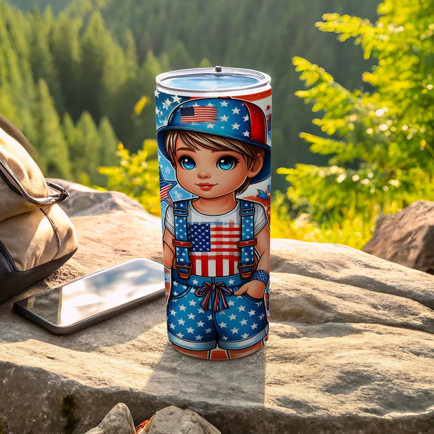 Boy in American flag outfit on patriotic tumbler with mountains in background.