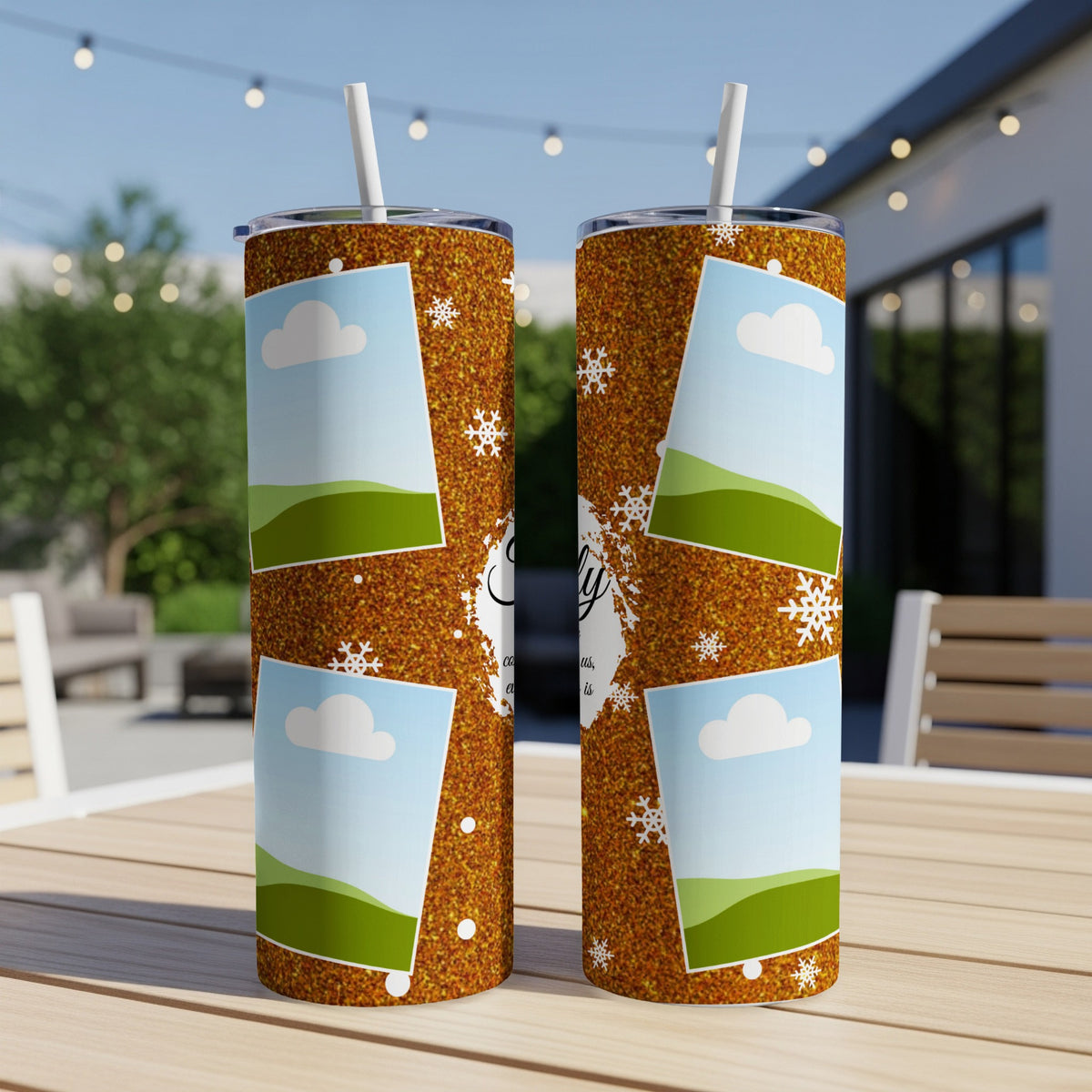Two tumblers with a glittery gold design featuring photos, clouds, and snowflakes.