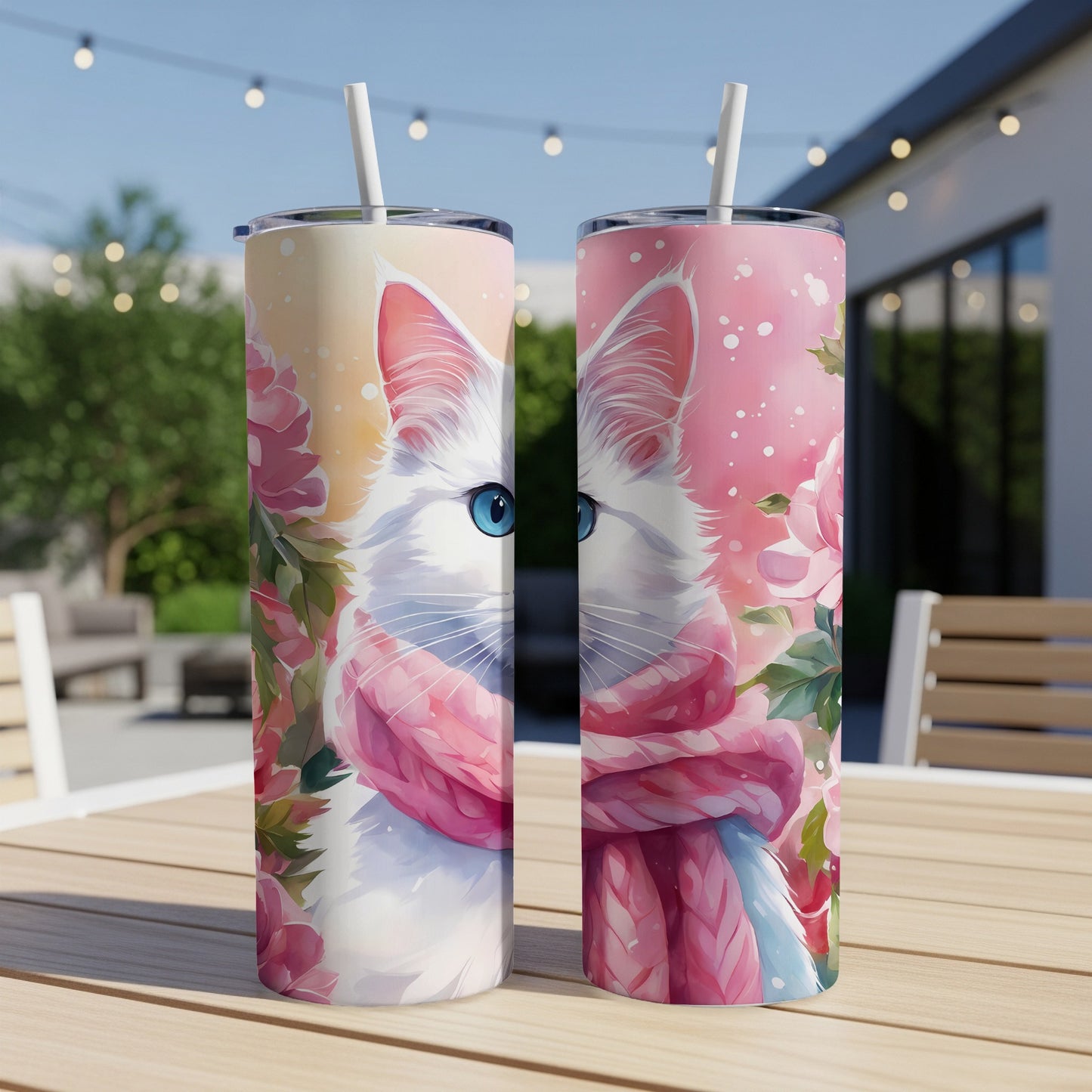 White cat with blue eyes wearing pink scarf and floral pattern.