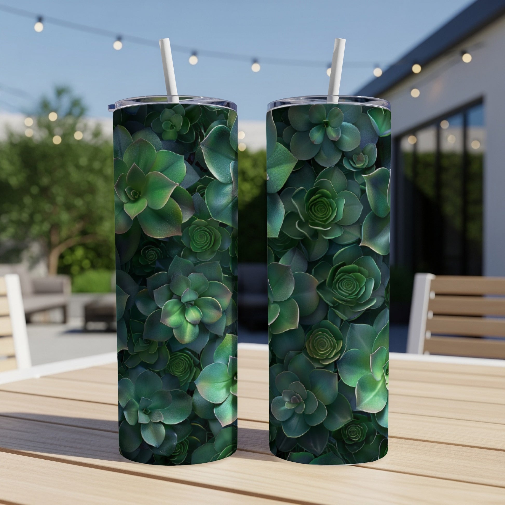 Two tumblers with a close-up succulent plant pattern on a wooden table.