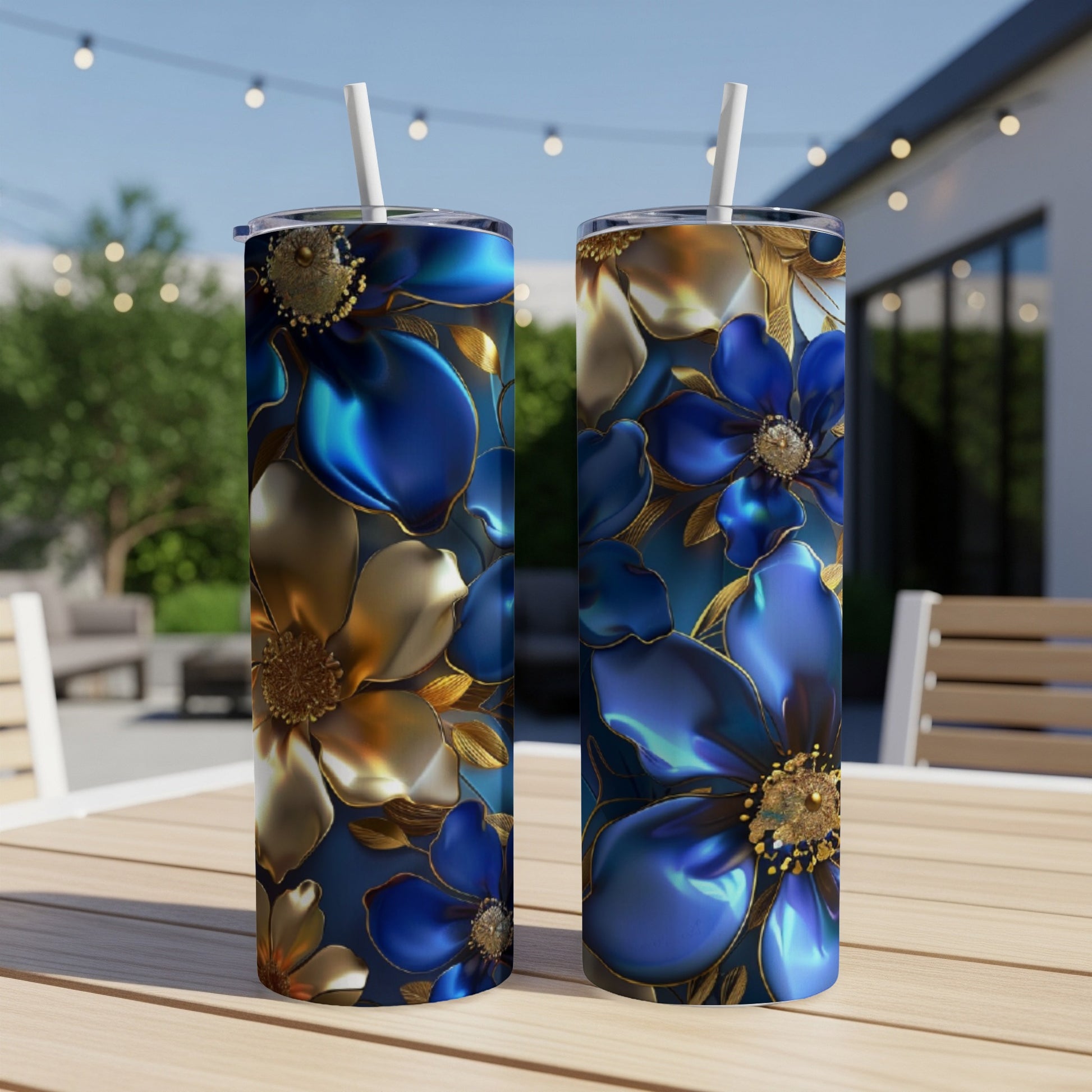 Two tall tumblers with a dark blue floral design featuring gold accents.