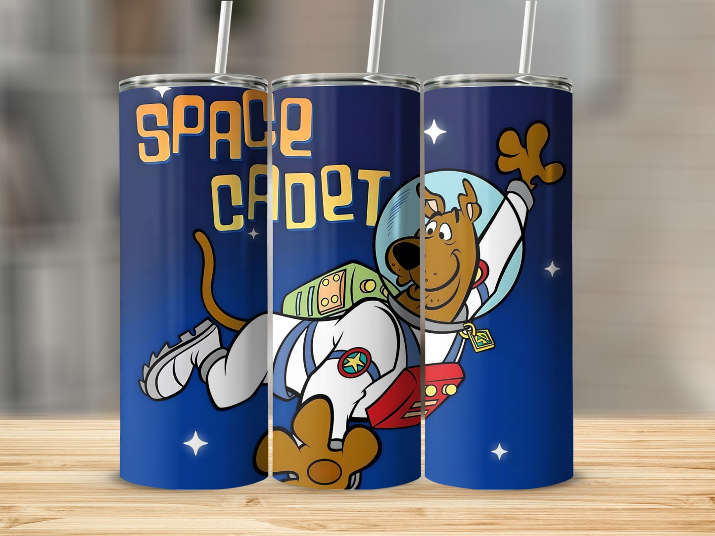 Scooby-Doo in a space suit on a "SPACE CADET" tumbler against a starry blue background.