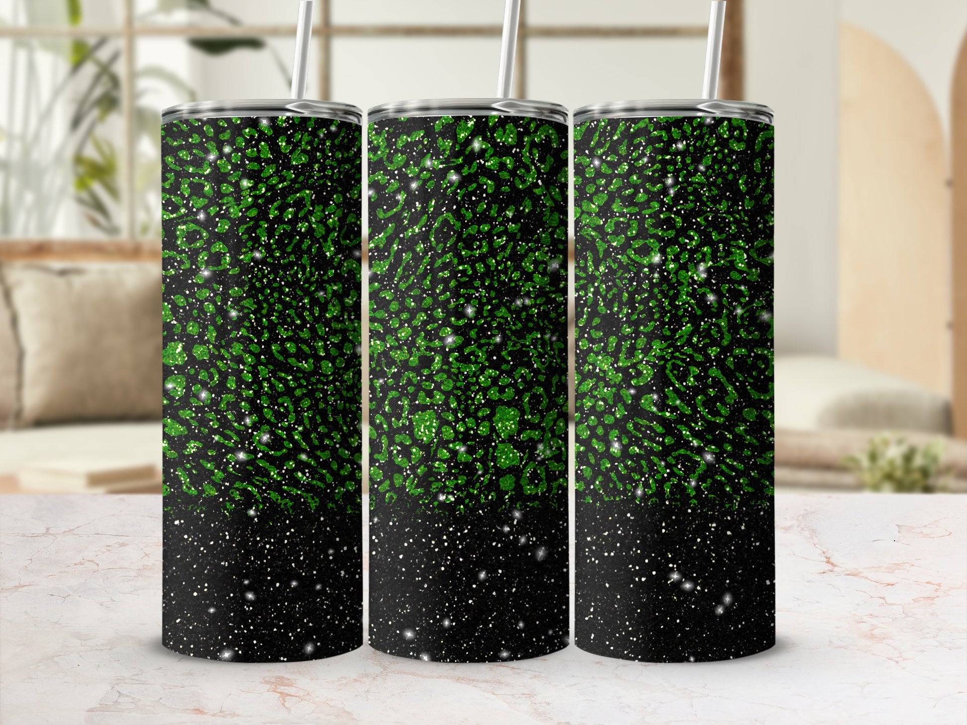 Three green glitter tumblers with black speckled tops.