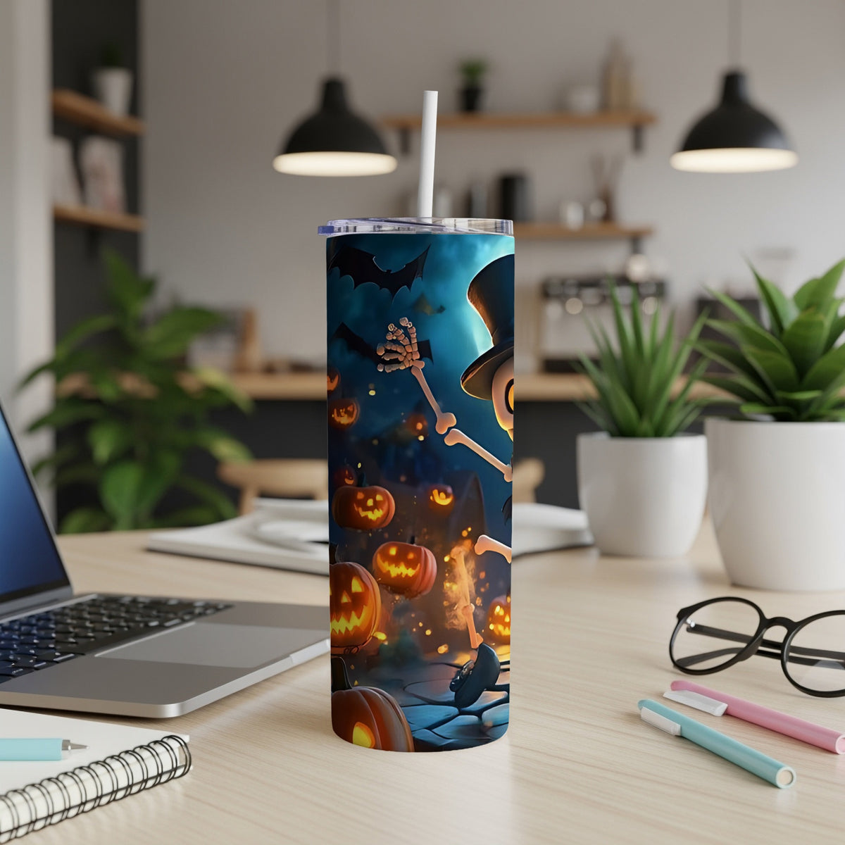 Skeleton with top hat and pumpkins on a Halloween-themed tumbler with a straw.