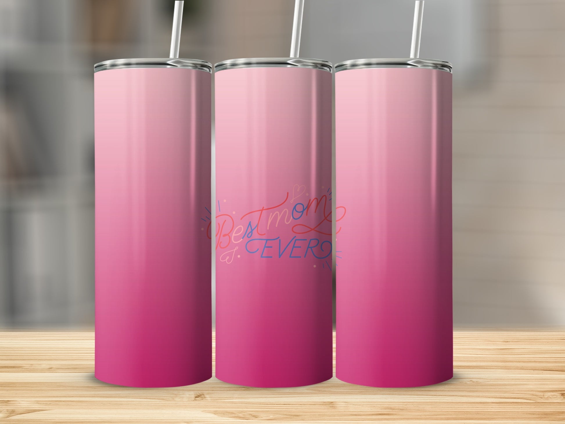Pink gradient tumbler with "Best Mom Ever" text.