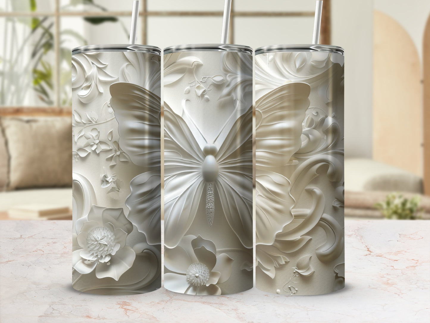 Three white textured tumblers with butterfly and floral embossed designs.