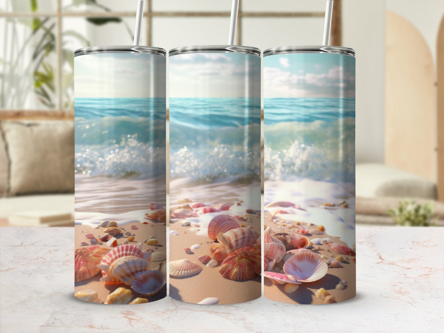 Three tumblers with a seashell and beach scene design.