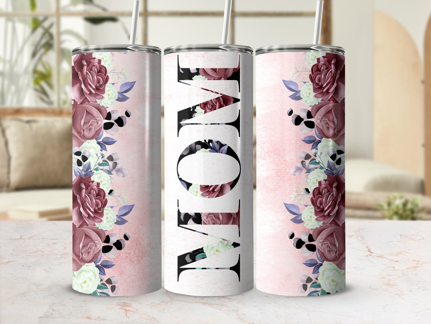 "Mom" text on tumbler with floral design and pink distressed background.