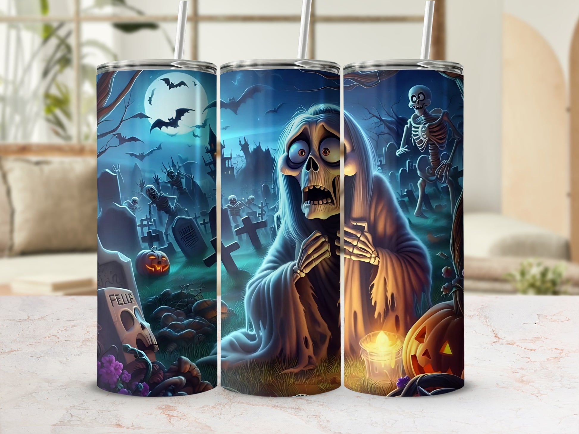 Three tumblers with a spooky Halloween graveyard scene featuring skeletons and ghosts.