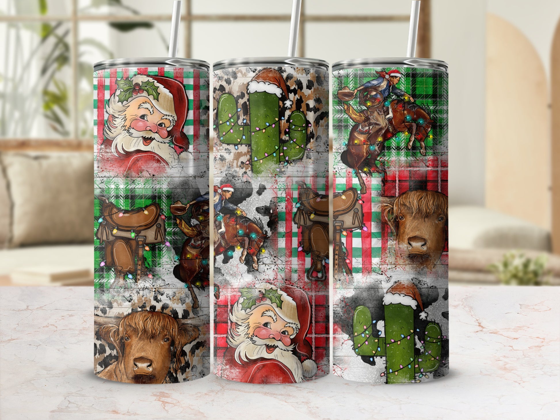 Three tumblers with festive Christmas designs featuring Santa, cacti, and cows.