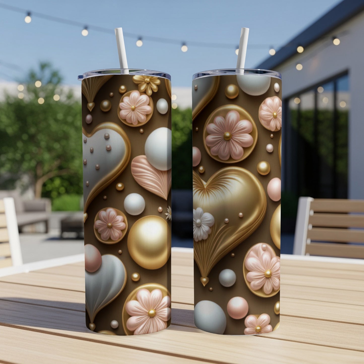 Two tall tumblers with scattered heart and floral patterns on a wooden table.